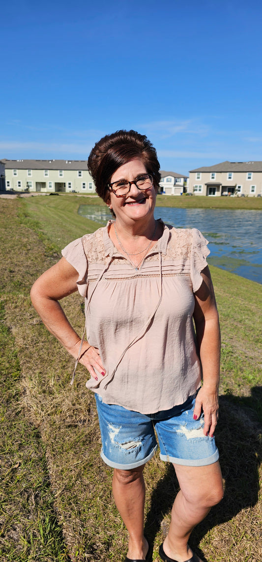 Freshen up your wardrobe with the "Faith Light Mocha" top! With split neckline, flutter sleeves, and lace detail, this top is perfect for any occasion. And tie it with a cute neck tie for an extra WOW factor. Be bold, be beautiful, and stay full of faith! Sizes small through large.