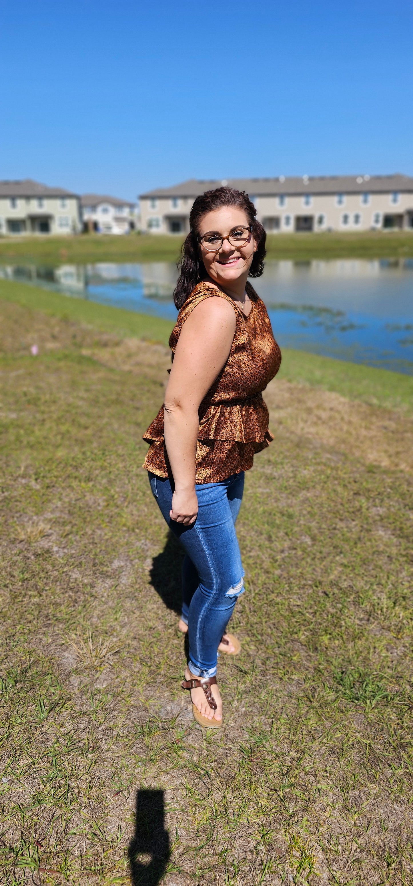Show off your wild west style with this fashionably rustic "Merida" top! Featuring a beautiful silky satin fabric, an asymmetrical ruffle bottom, an elastic waist, and a keyhole back, you'll be riding off into the sunset in no time! Yee-haw! Sizes small through large.