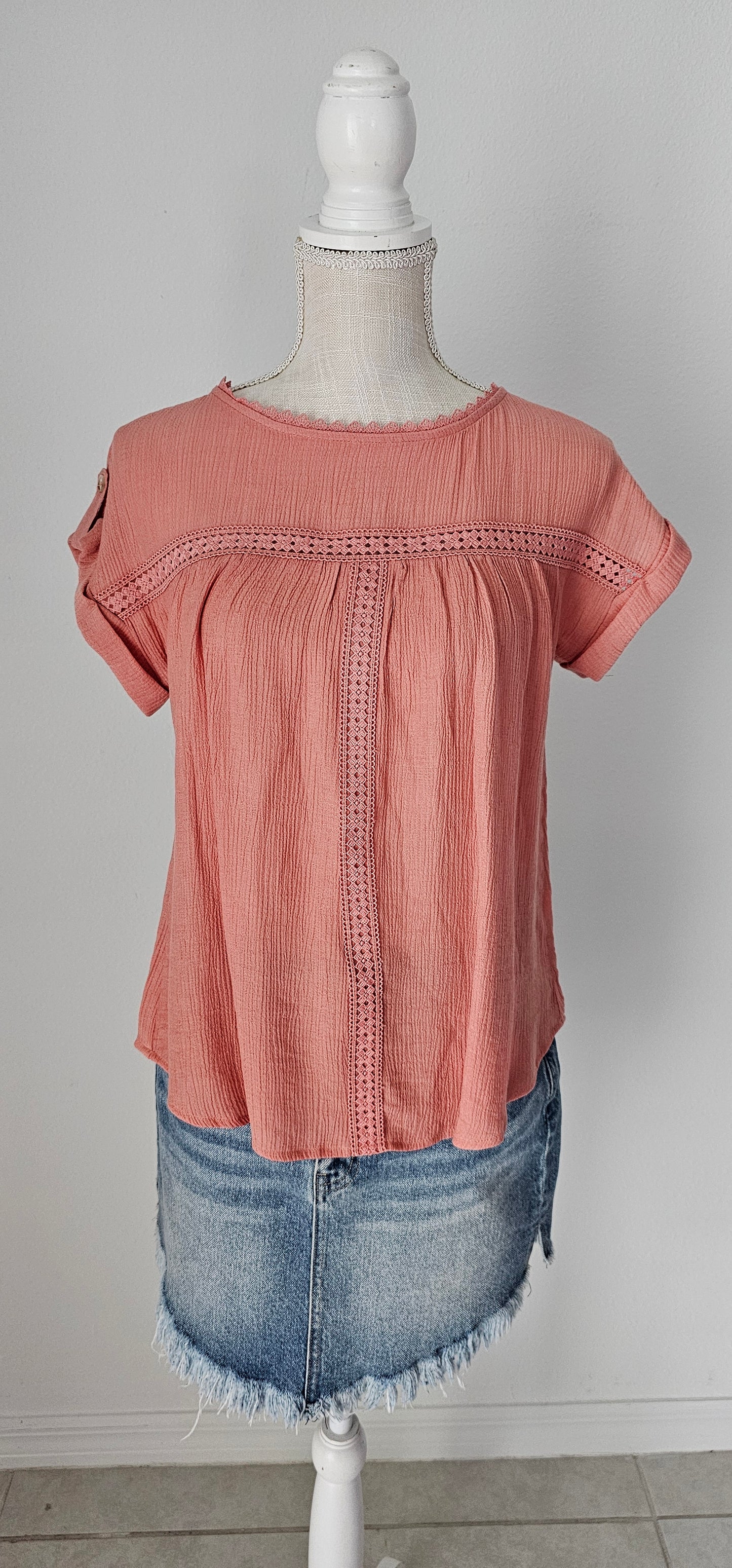 Add a touch of whimsy to your wardrobe with our "Paradise Dusty Apricot" lace top! Featuring round neck and classic lace trim, plus a button tab sleeve and short sleeve, you'll feel like you're in a floral-filled wonderland. (Oh yeah!) So, bring on the romance! Sizes small through large.