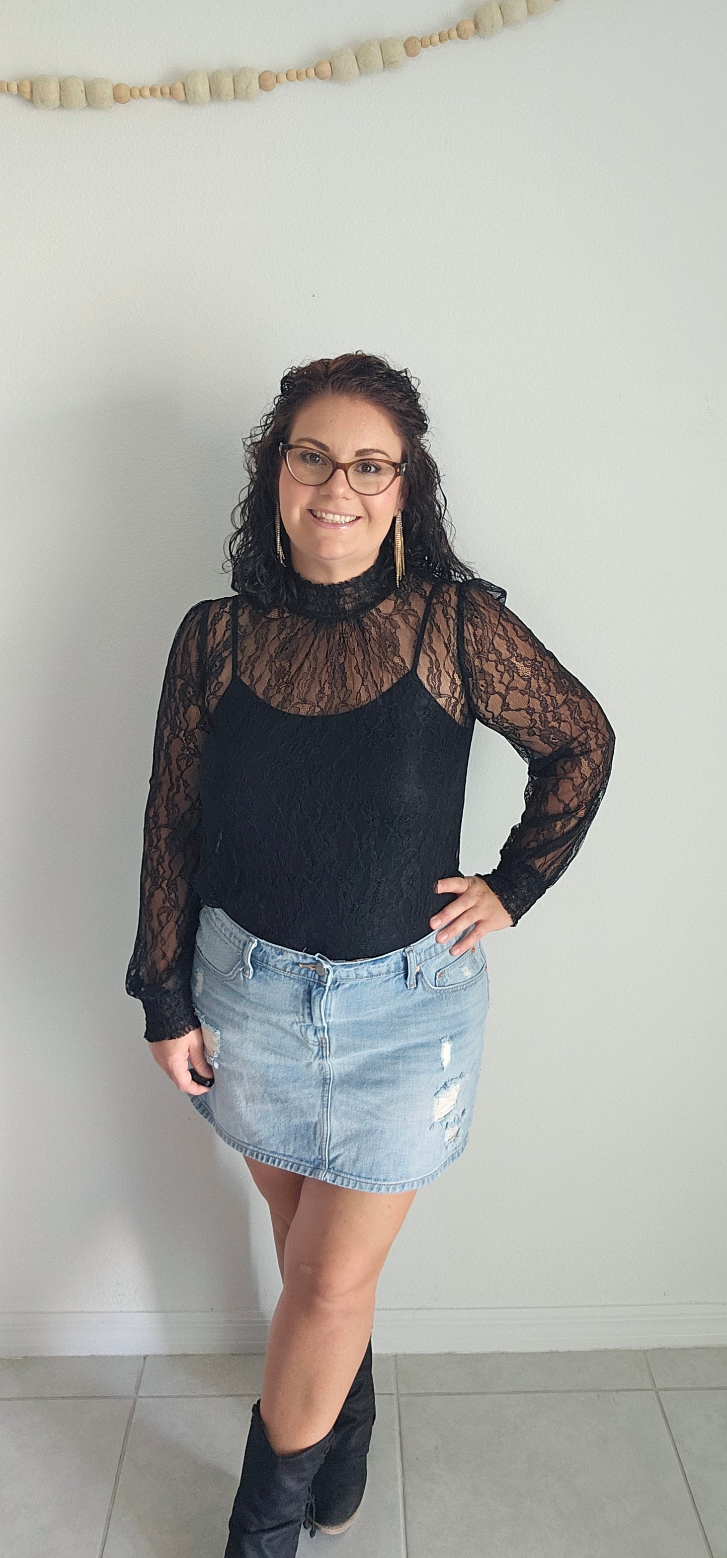 Look luxe and fabulous in the "Lainey Black Mesh Lace Long Sleeve Top" - complete with a elastic mock neck, elastic cuffs, and a beautiful floral pattern! And if you're feeling extra daring, you can even pair it with a bodysuit for a sassy look sure to turn heads! Sizes small through large.