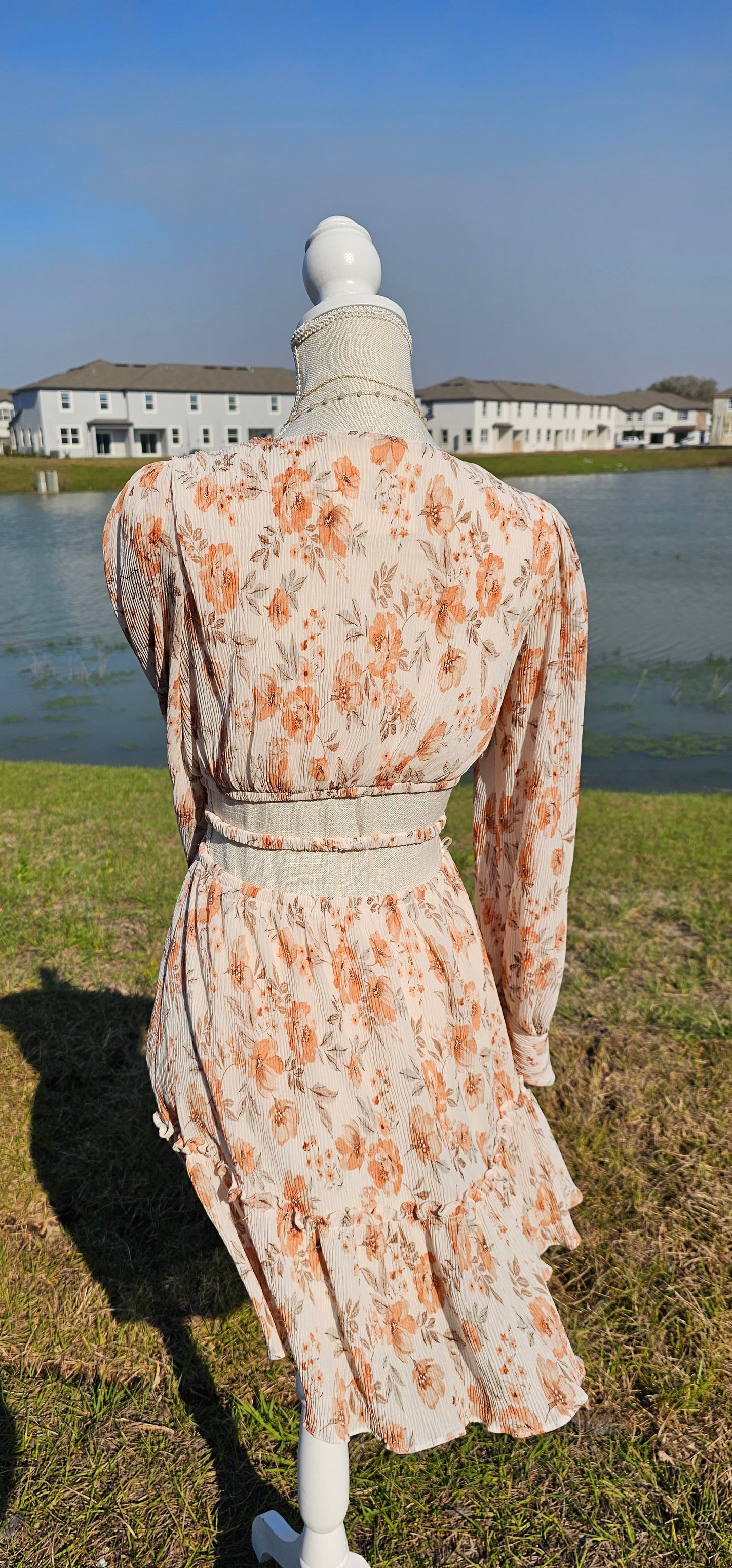 Turn heads in our "Sophie Floral Mini Dress"! This beautiful dress features a V-neckline, waist cut-out, bishop sleeves, and a ruffle hem that's sure to make you feel like a total cutie! And with its cute floral design, you'll have everyone blooming with envy. Get ready to be the center of attention! Sizes small through large.