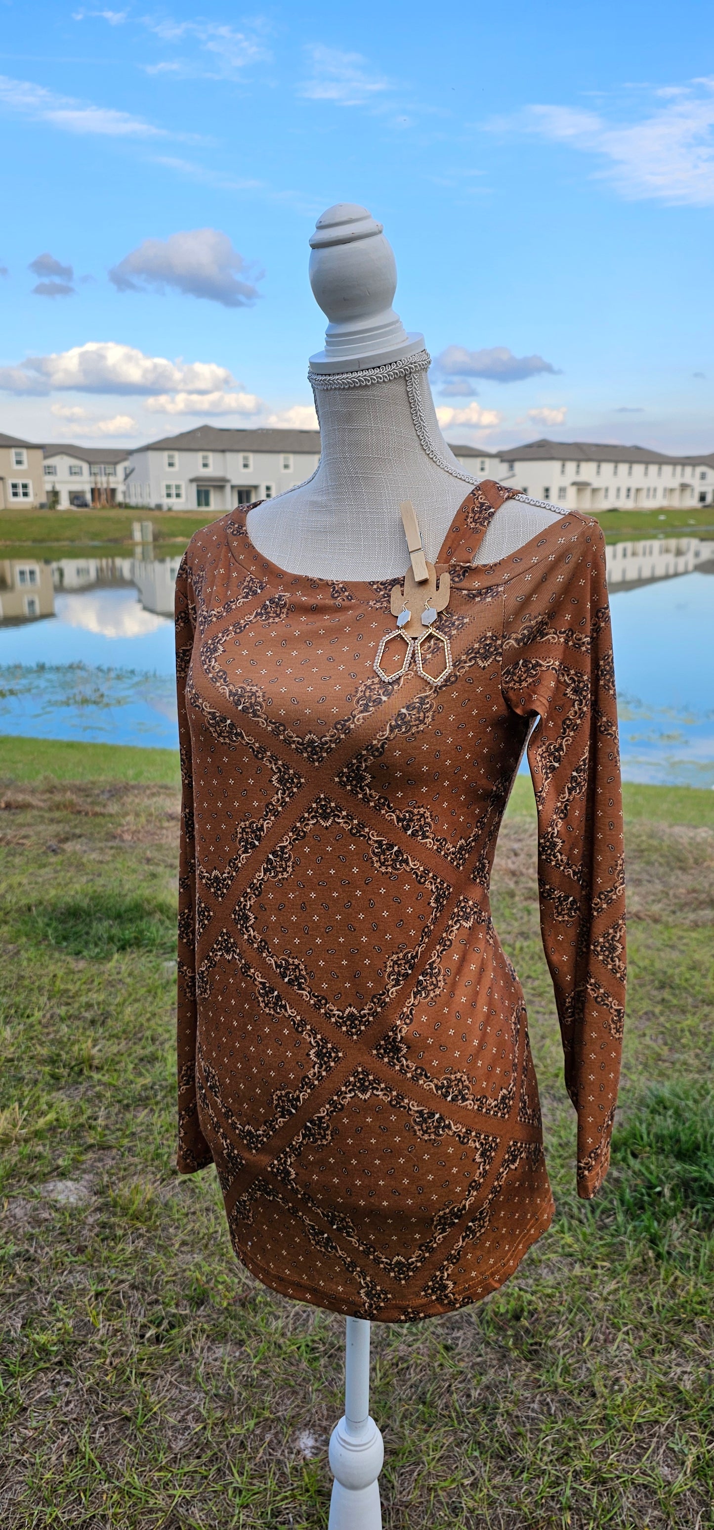 This top features one cold shoulder with strap, long sleeves, with bandana print. Light weight and breathable. Go ahead and wear it line dancing, to the rodeo, hanging out with your friends, or just running errands. You know that you want to give it a try! Sizes small through x-large.