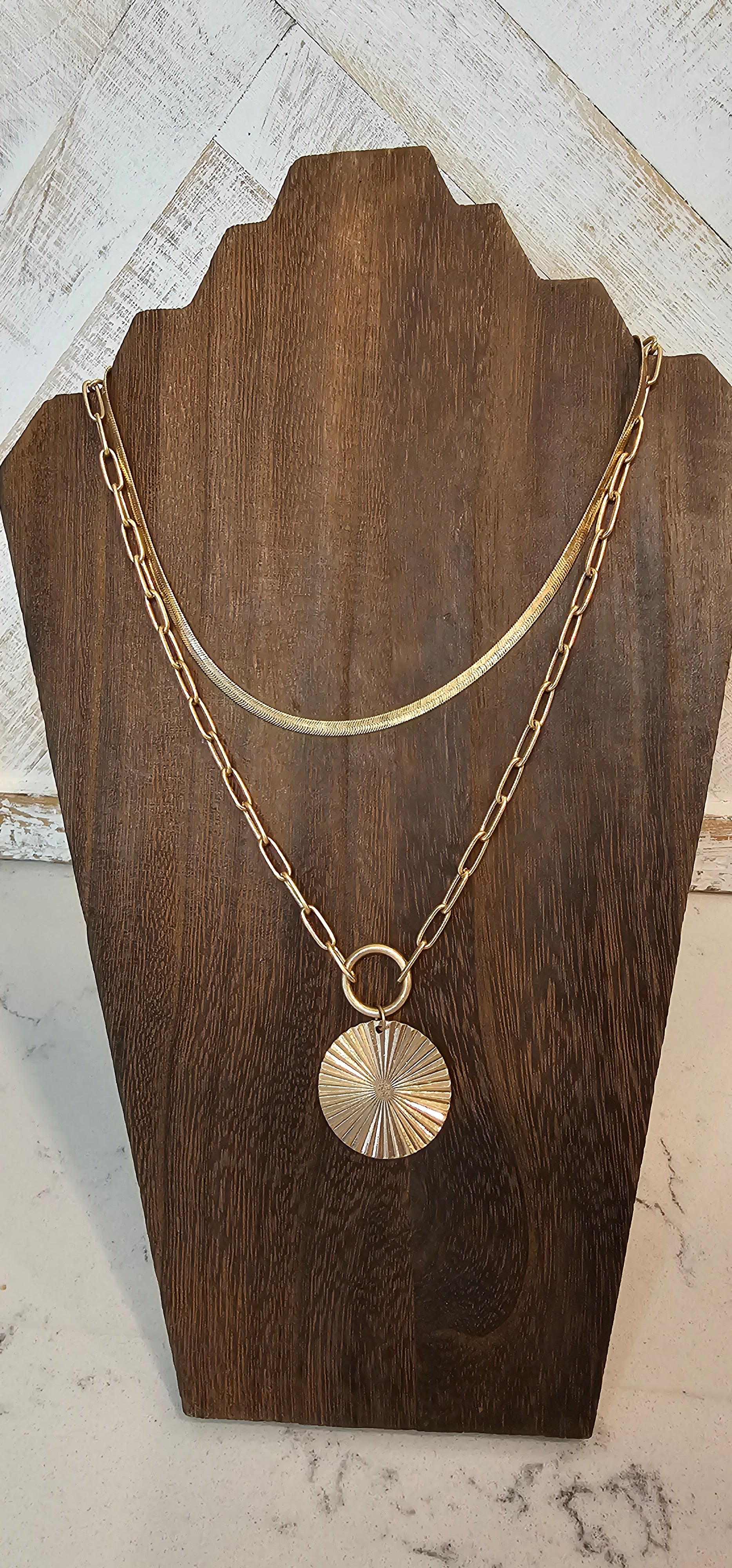 Approximate Length: Adjustable chain 16+2 inches Color: Gold snake chain and link chain with circle pendant Limited supply!