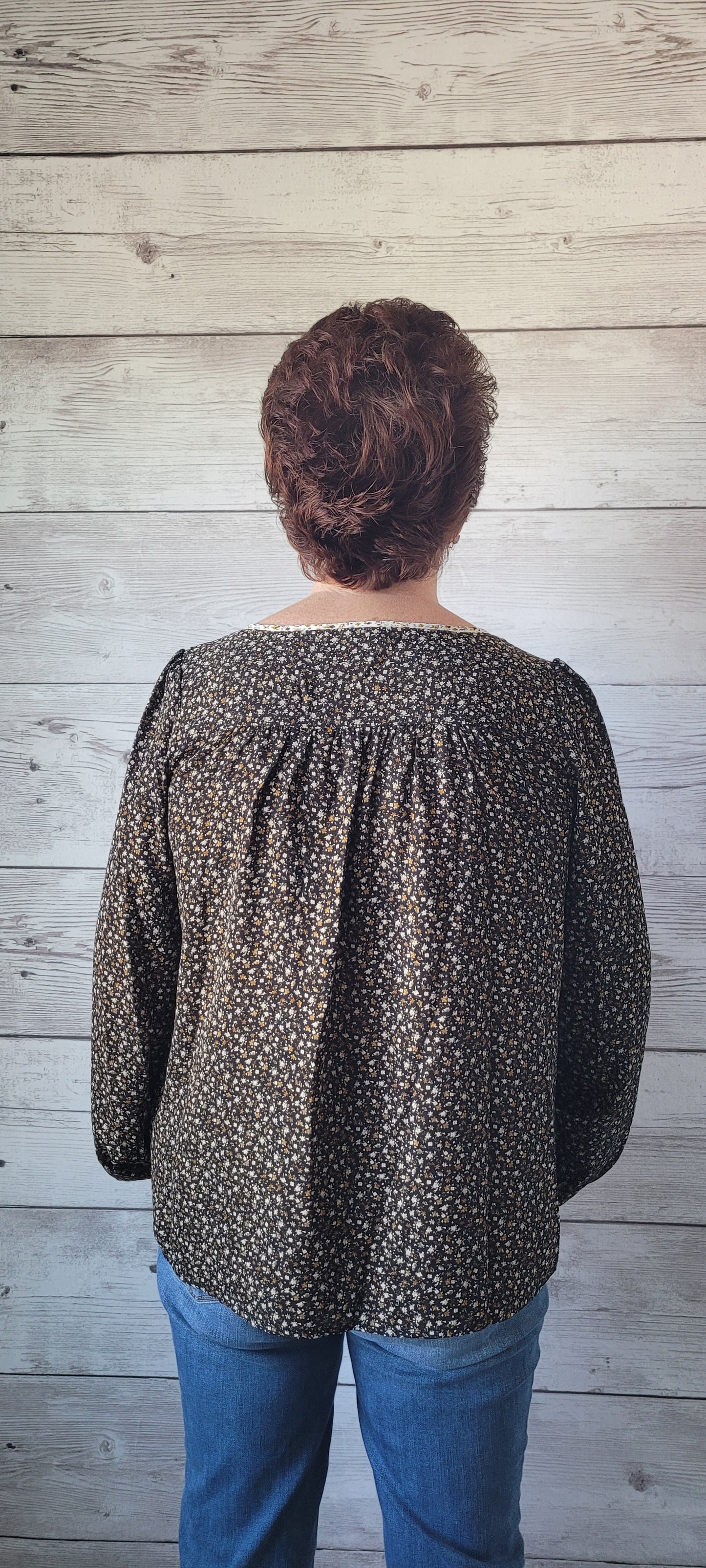 Elevate your outfit with the Luna Black & Ivory Floral Blouse! This blouse features a front tie and split round neck for an undeniably fun and flirty look, plus cute button cuff sleeves for an extra stylish touch. Jazz up any occasion with this unique and playful garment and bring the party wherever you go! Small through large.