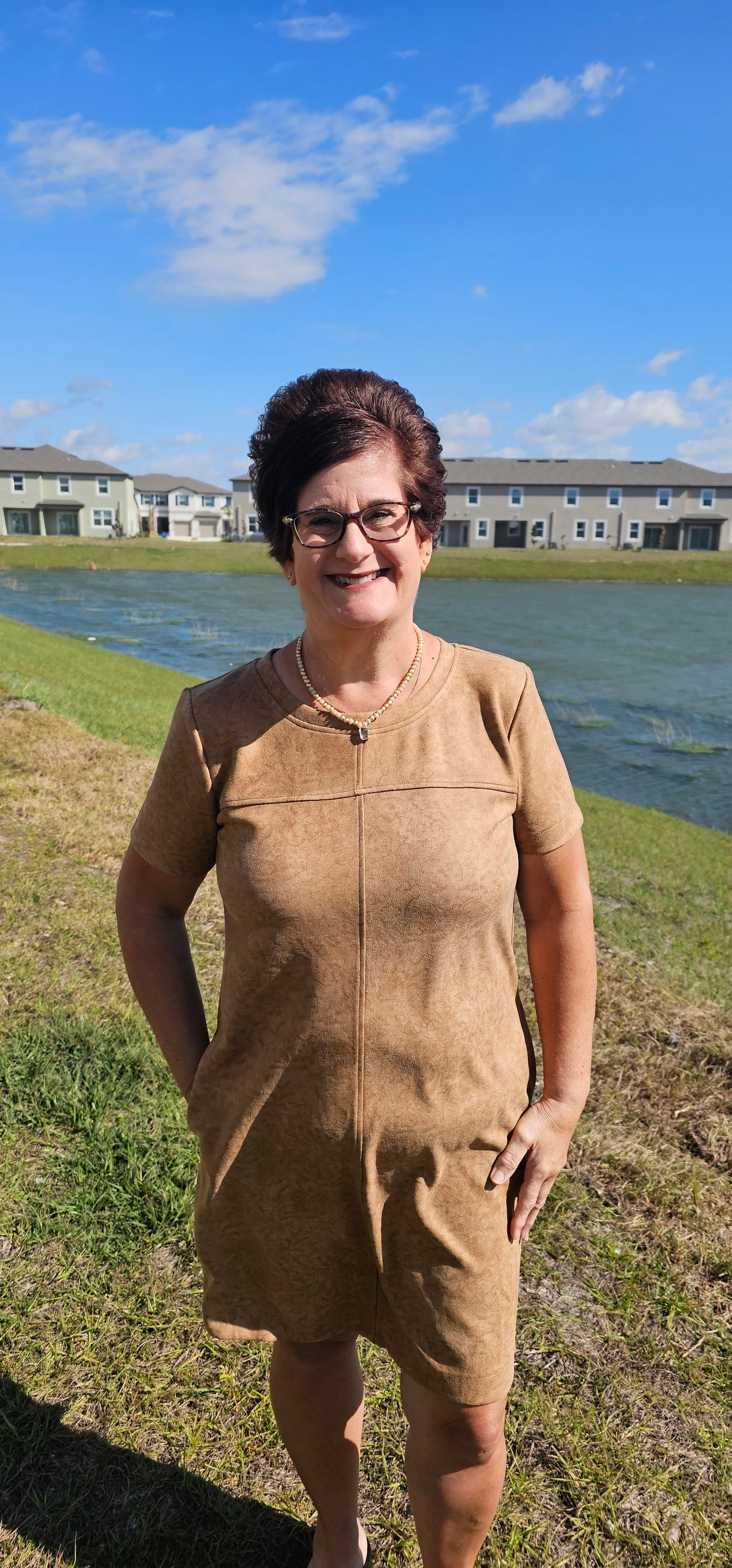 Dress to impress in this "Winona Mocha Printed Suede Shift Dress" and show off your country flair! With its round neckline, short sleeves, side pockets, and zipper back closure, it’s sure to be your go-to look for any special occasion. Yee-haw! Sizes small through large.