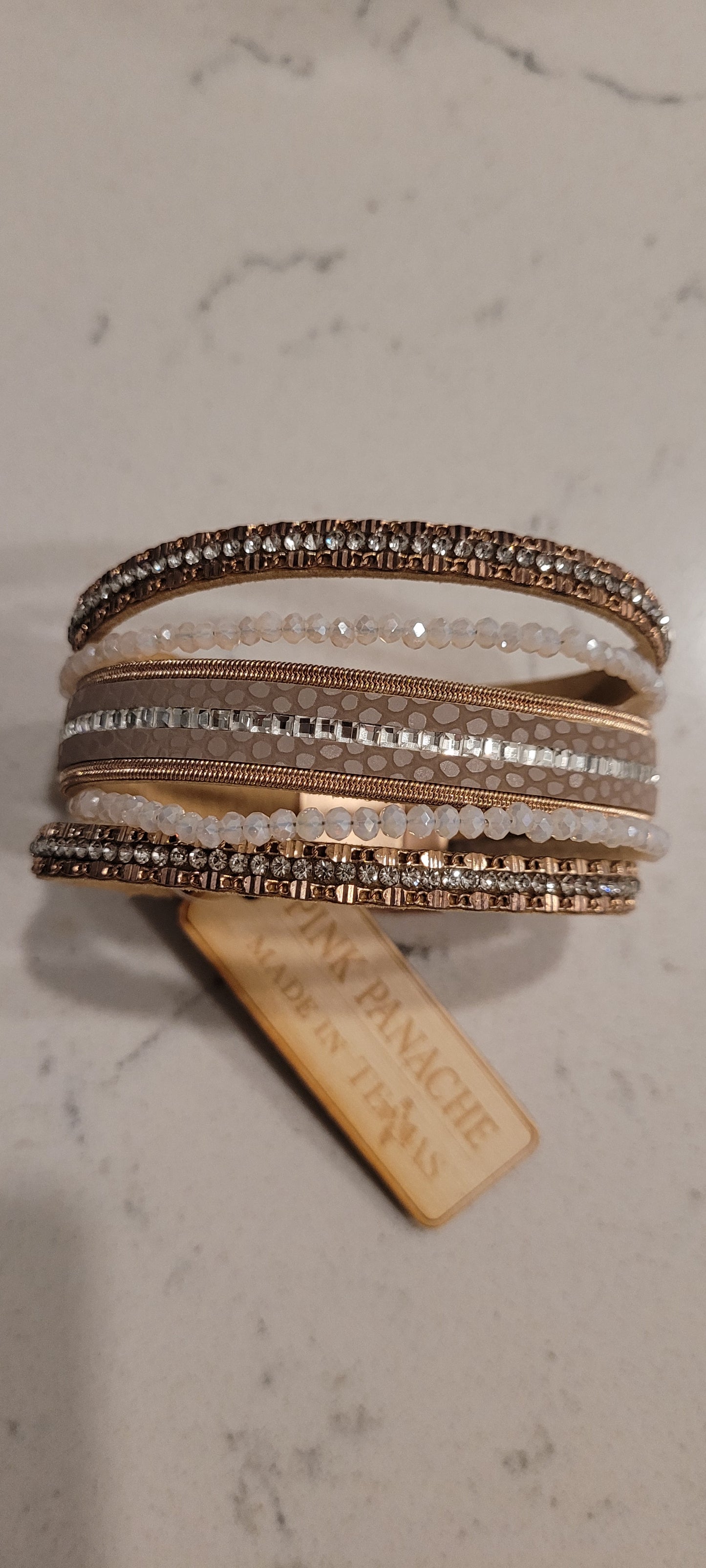 Pink Panache bracelet Color: 5-strand rose gold leather, white AB bead and rhinestone magnetic cuff bracelet Limited supply!