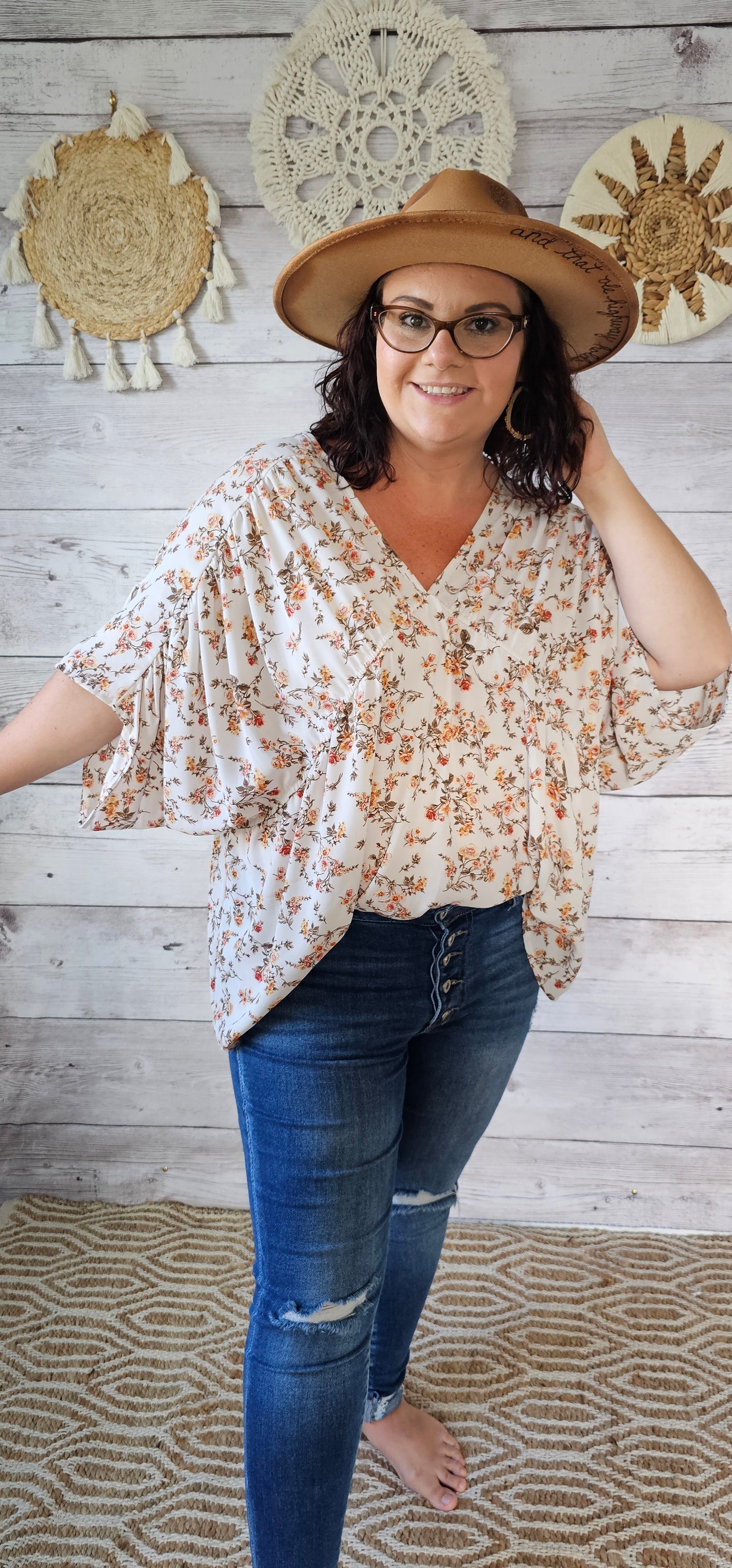 “Rosy Future” is a ivory loose fitting, flowy top. It features a rosy floral print, v-neck and v-back, pleated sleeves. This top is sheer but not see through. It is great for vacation, an evening out or casual event. Sizes small through large.