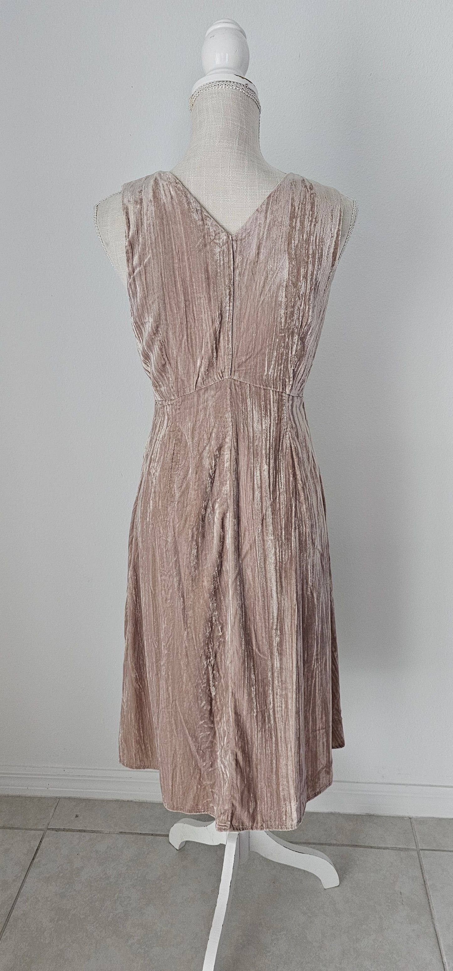Look glam and chic in this "Amiri Almond Crinkle Velvet Sleeveless Dress"! With a luxurious v-neckline and back, zip it up with ease and get ready to turn heads. Slip it on and you'll be looking smokin' hot - velvet never looked so good! Sizes small through large.