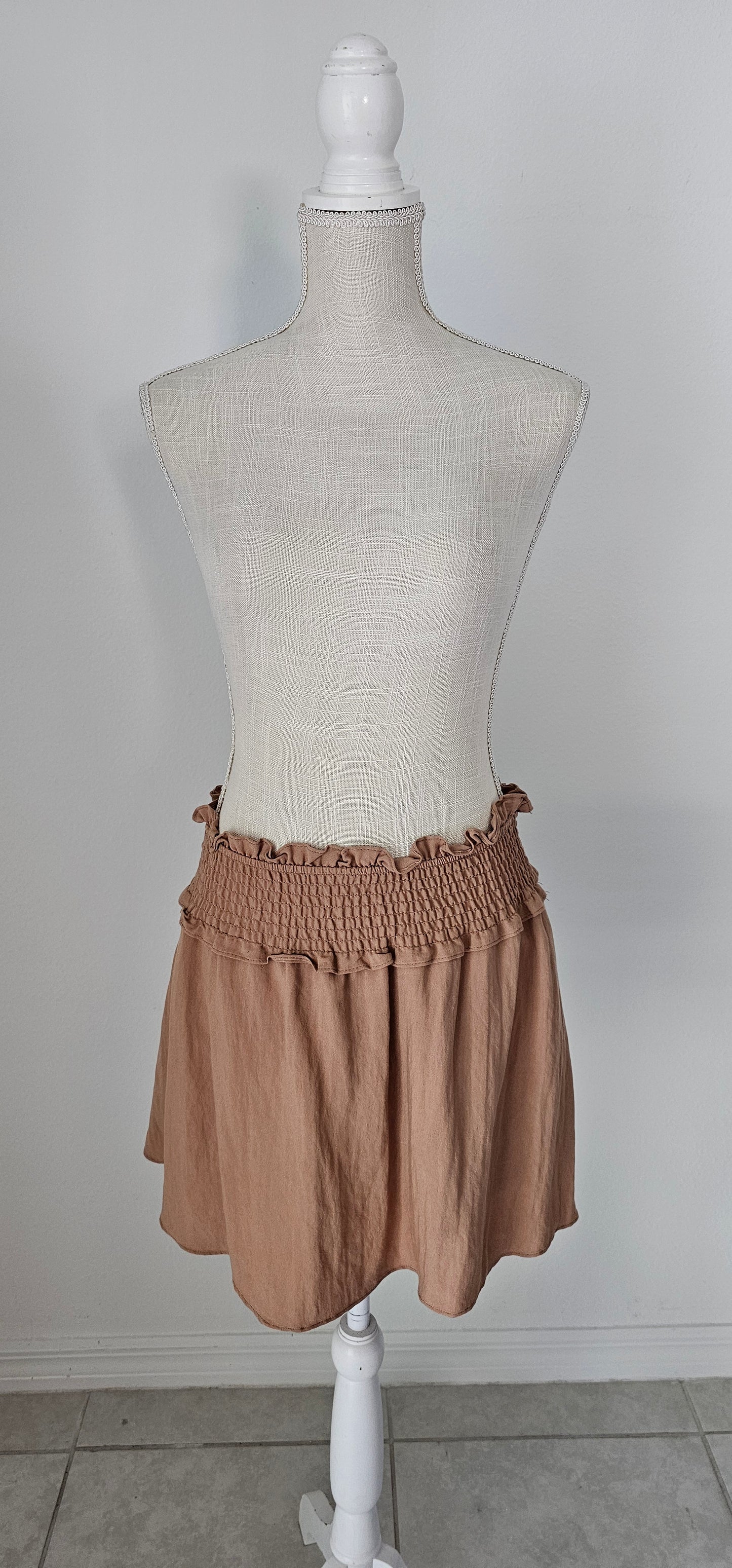 Let’s go exploring! “Lost In The Desert Skirt” features a cinched elastic waistband with ruffled trim, smocked skirt, and lined with shorts. This skirt pairs perfectly with “Lost In The Desert Top”. It is lightweight and breathable. Imagine exploring the mountains out west or dipping your toes in the Gulf of Mexico! This duo makes a perfect vacation outfit! Sizes small through large.