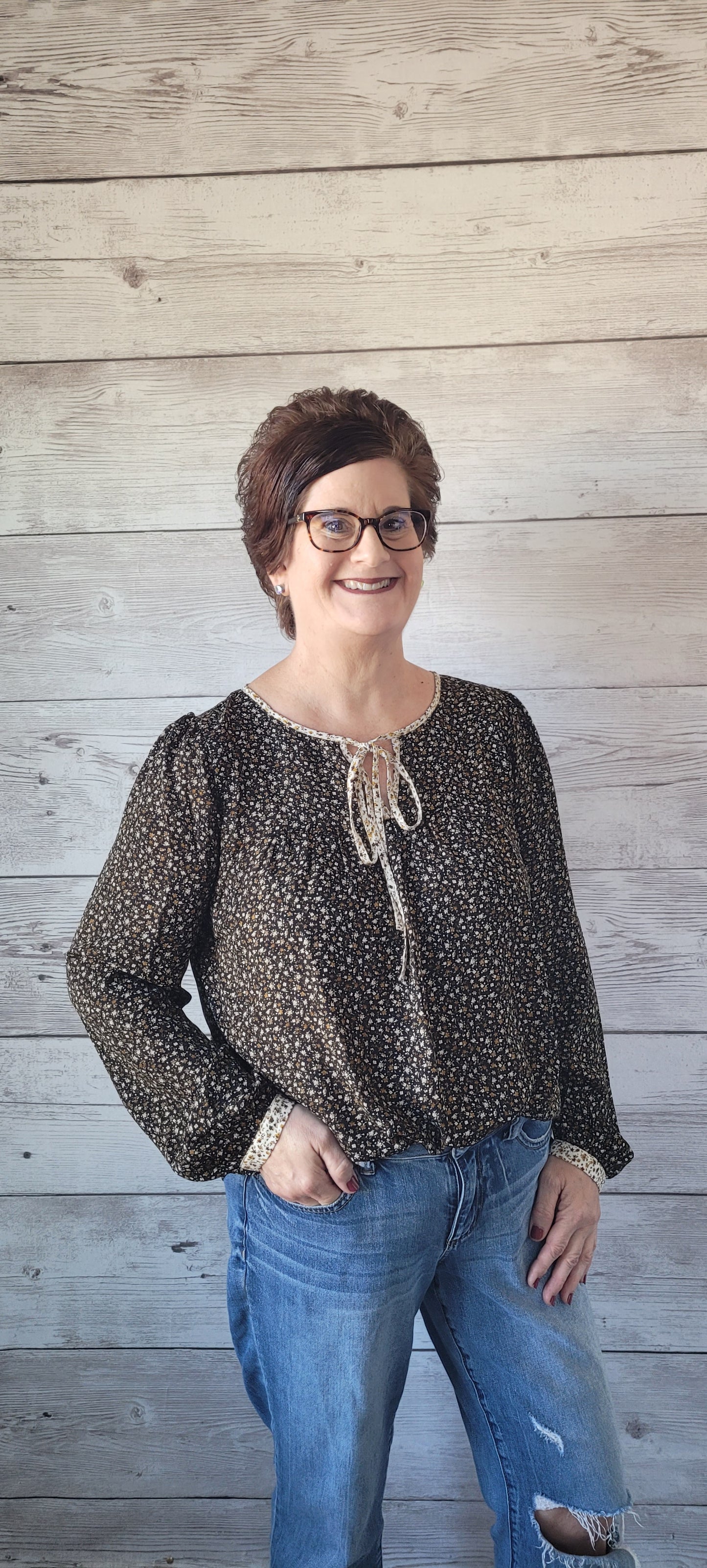 Elevate your outfit with the Luna Black & Ivory Floral Blouse! This blouse features a front tie and split round neck for an undeniably fun and flirty look, plus cute button cuff sleeves for an extra stylish touch. Jazz up any occasion with this unique and playful garment and bring the party wherever you go! Small through large.