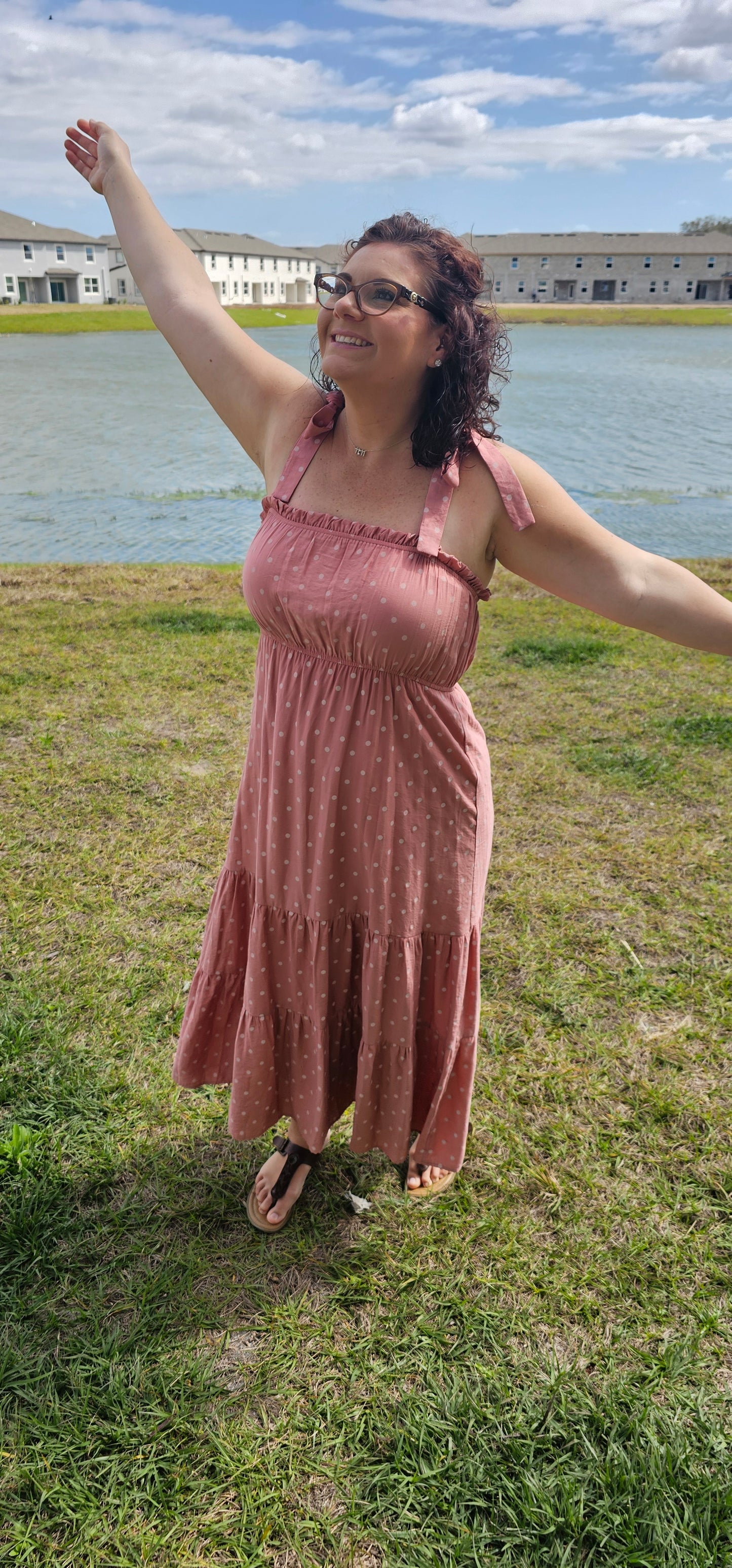 Look oh-so-stylish in this "Lily Dusty Rose Polka Dot" midi dress! With its square neckline, sleeveless design and tie straps, this dress is everything your summer wardrobe needs. The midi length and tiers give you the perfect shape for any occasion. Let the fun begin! Sizes small through large.