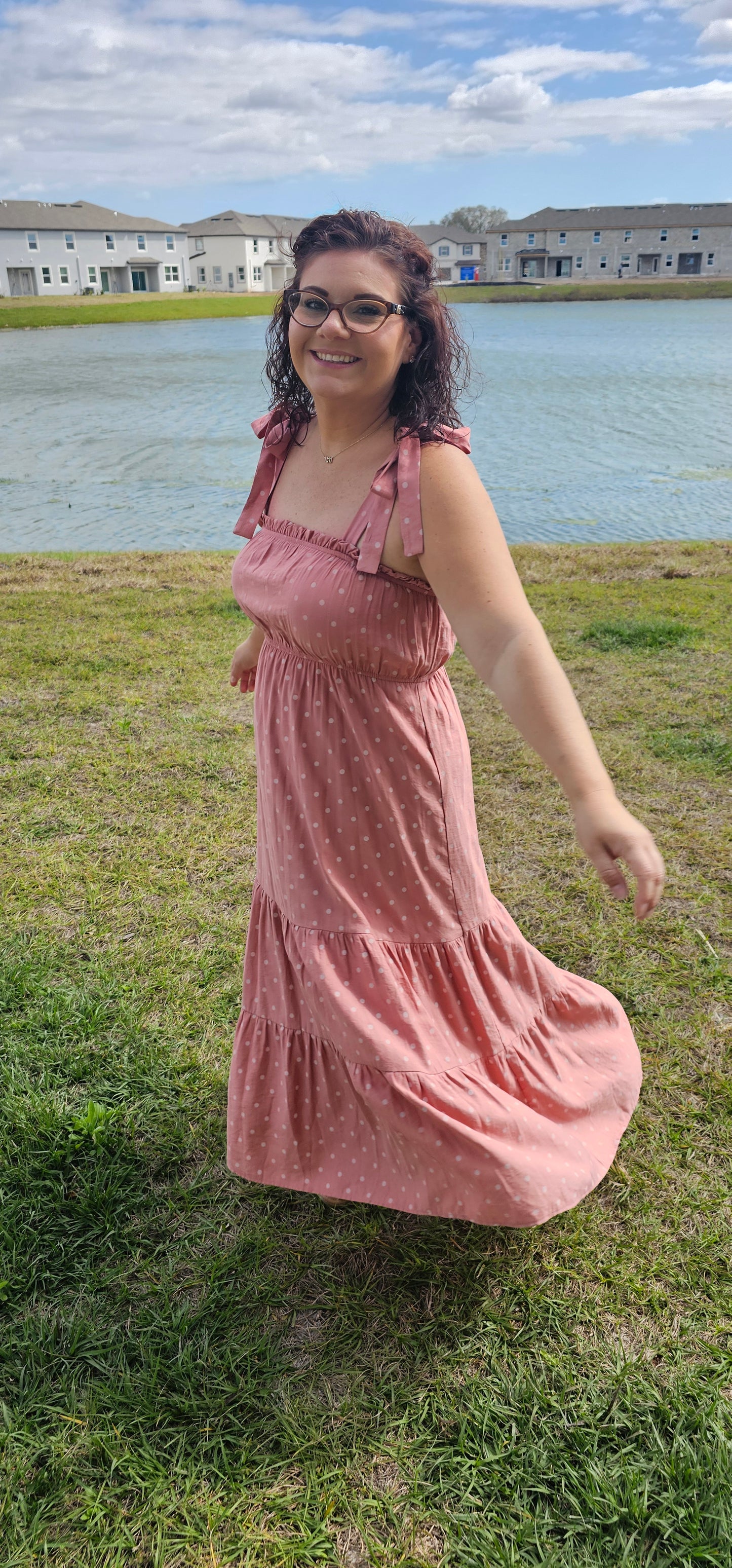 Look oh-so-stylish in this "Lily Dusty Rose Polka Dot" midi dress! With its square neckline, sleeveless design and tie straps, this dress is everything your summer wardrobe needs. The midi length and tiers give you the perfect shape for any occasion. Let the fun begin! Sizes small through large.