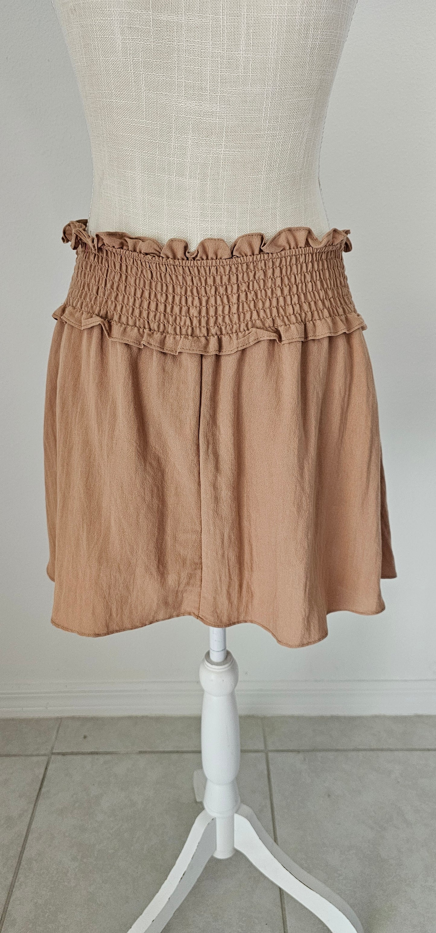 Let’s go exploring! “Lost In The Desert Skirt” features a cinched elastic waistband with ruffled trim, smocked skirt, and lined with shorts. This skirt pairs perfectly with “Lost In The Desert Top”. It is lightweight and breathable. Imagine exploring the mountains out west or dipping your toes in the Gulf of Mexico! This duo makes a perfect vacation outfit! Sizes small through large.