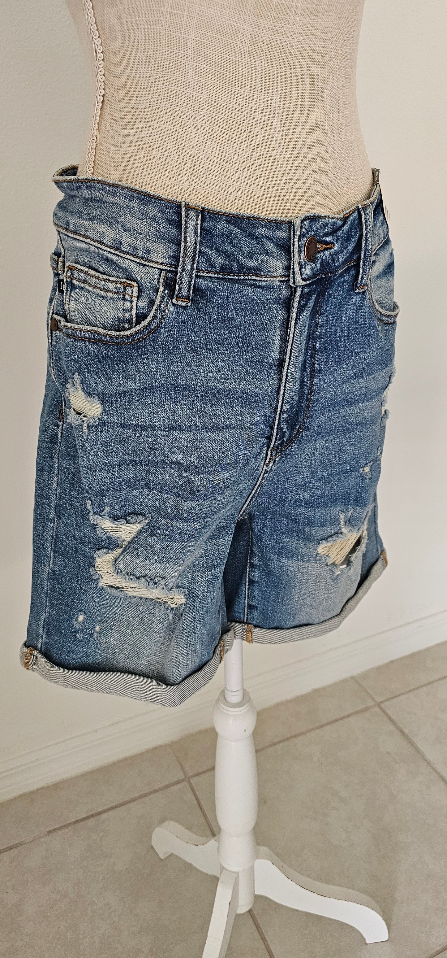 These high waist, mid- length, distressed shorts feature, cuffed leg, distressed look on front of shorts and the back pockets. These shorts are very stretchy for comfort. A great staple piece for your wardrobe. Go in style girl! You've go this!! Sizes small through x-large.