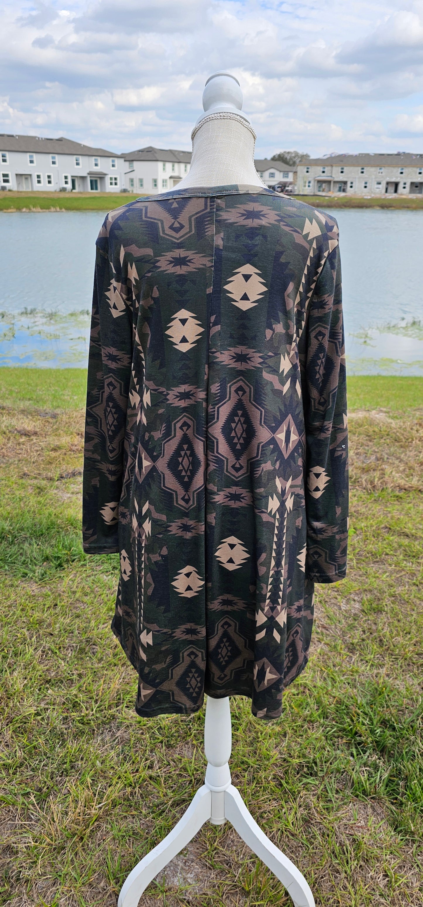 This dress features an Aztec design, key hole cut-out neckline, long sleeves, roomy and comfy. It has pockets! The colors are a camouflage. Imagine yourself wearing this cute number to the rodeo, going out on the town, hanging out with family and friends, you will be comfortable however you choose to wear your dress. Sizes small through x-large.