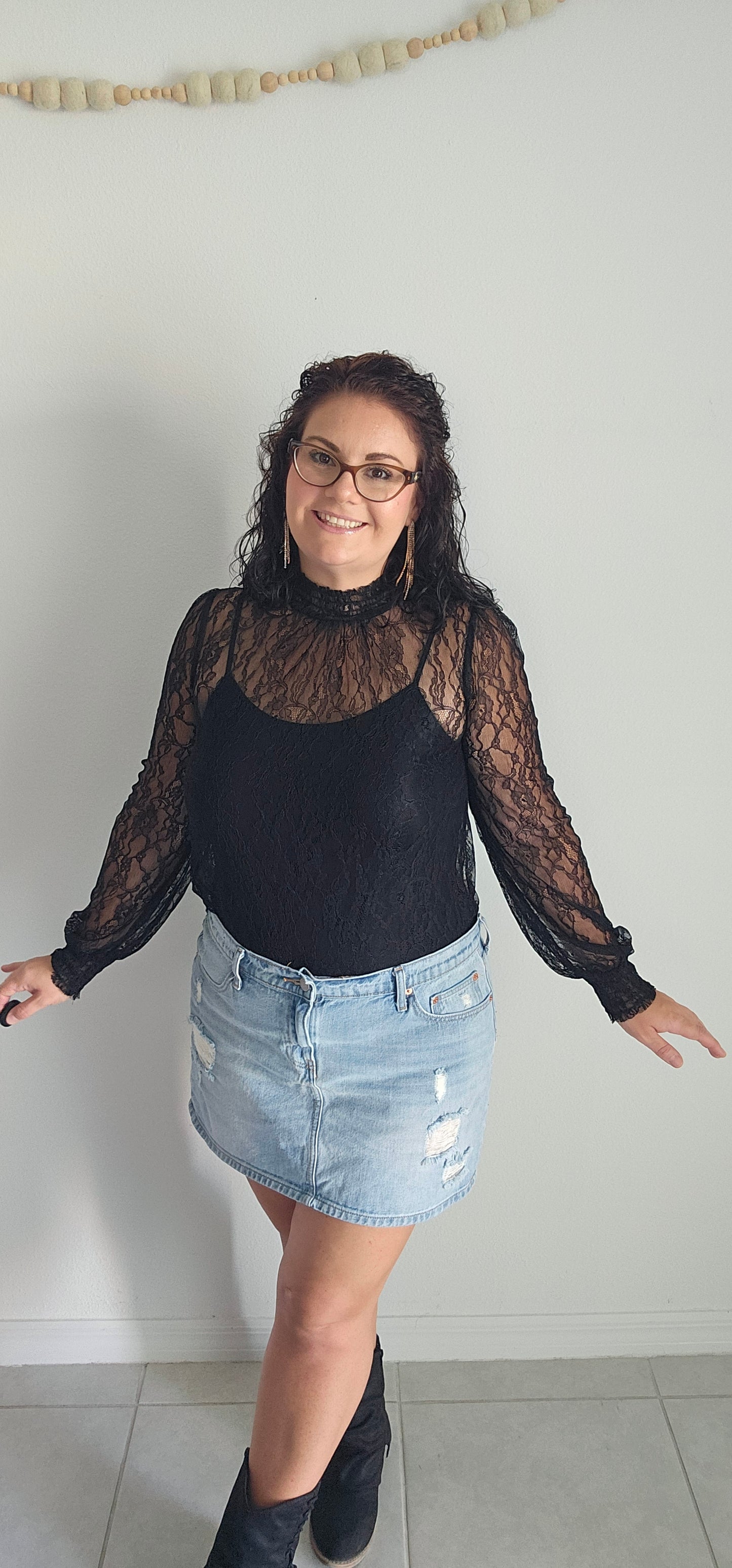 Look luxe and fabulous in the "Lainey Black Mesh Lace Long Sleeve Top" - complete with a elastic mock neck, elastic cuffs, and a beautiful floral pattern! And if you're feeling extra daring, you can even pair it with a bodysuit for a sassy look sure to turn heads! Sizes small through large.
