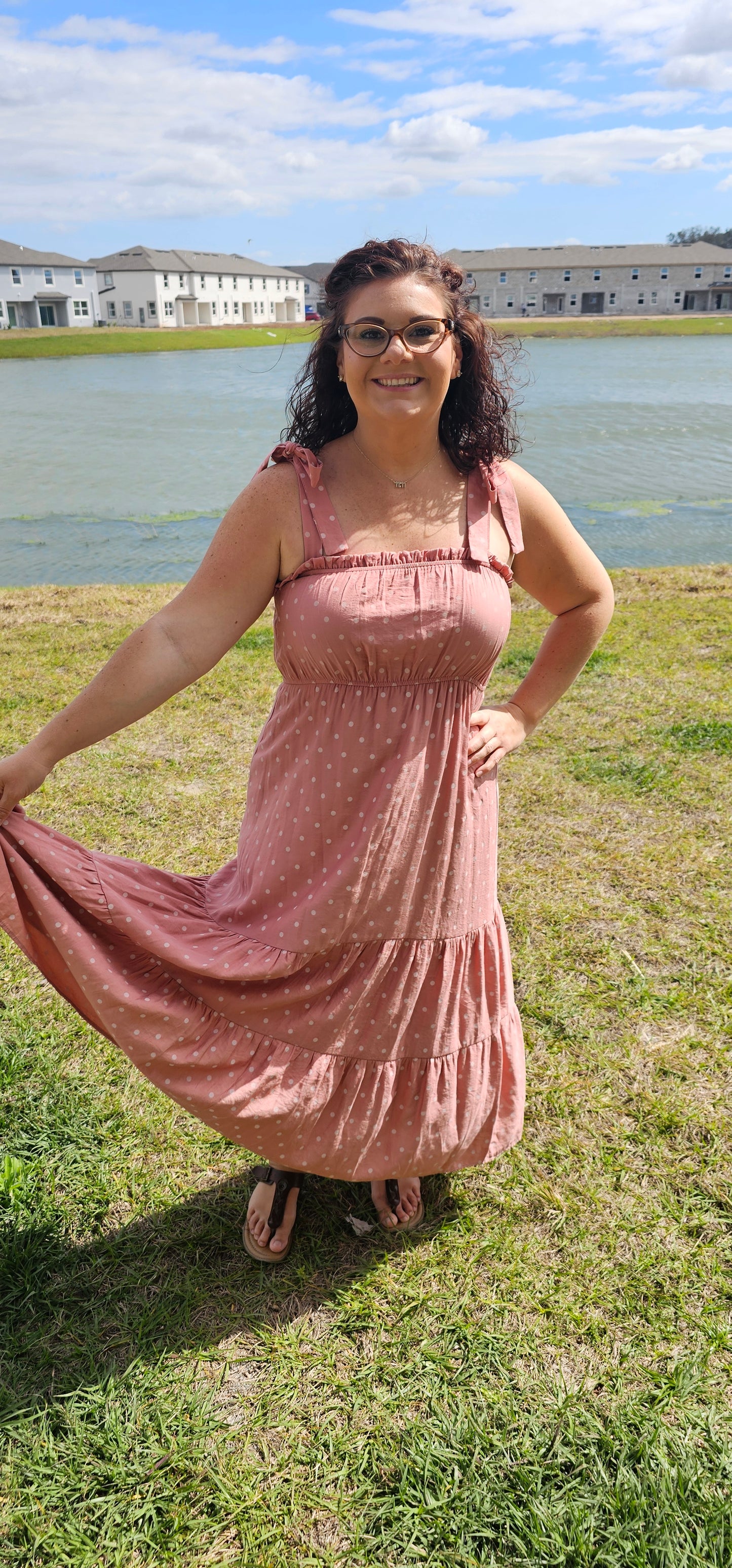 Look oh-so-stylish in this "Lily Dusty Rose Polka Dot" midi dress! With its square neckline, sleeveless design and tie straps, this dress is everything your summer wardrobe needs. The midi length and tiers give you the perfect shape for any occasion. Let the fun begin! Sizes small through large.
