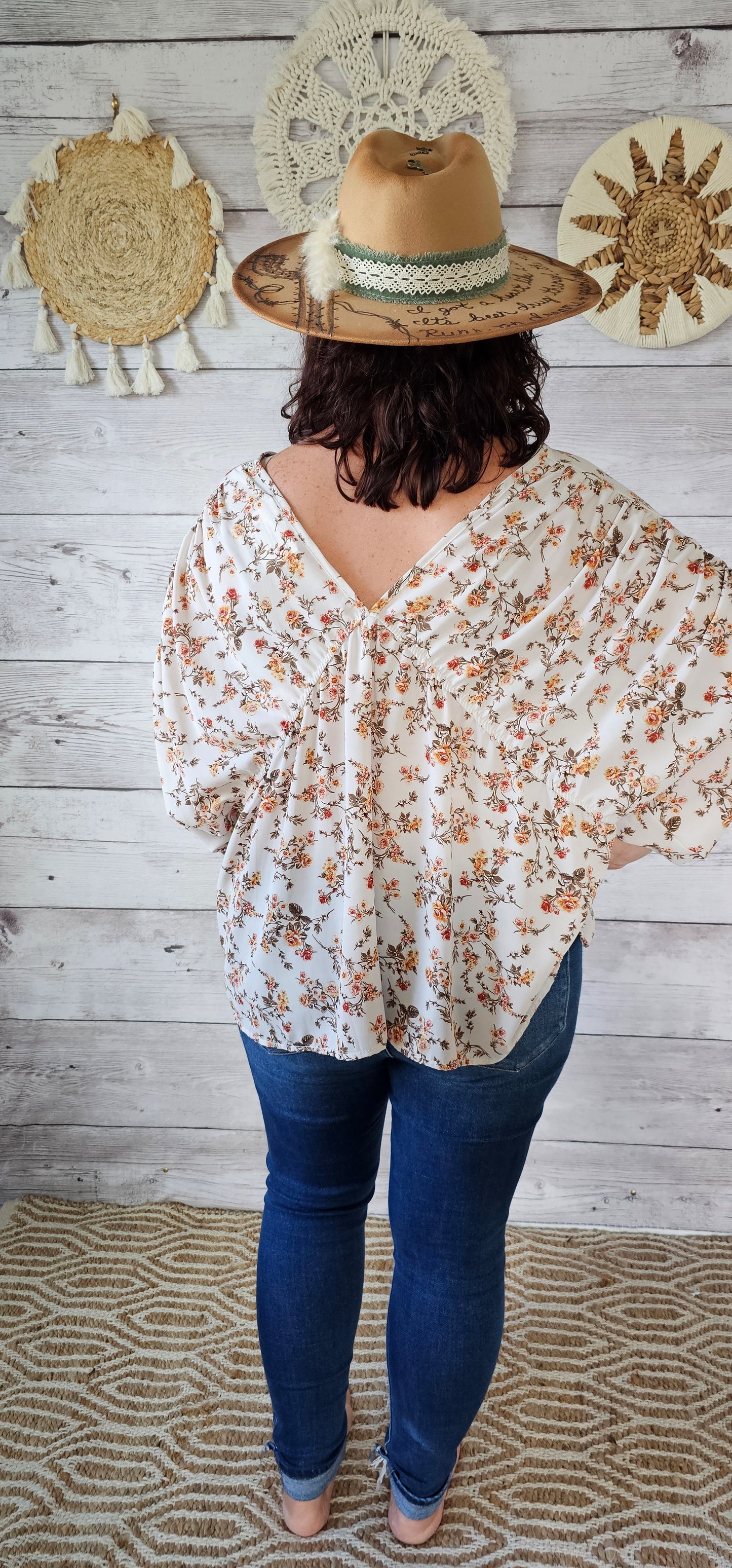 “Rosy Future” is a ivory loose fitting, flowy top. It features a rosy floral print, v-neck and v-back, pleated sleeves. This top is sheer but not see through. It is great for vacation, an evening out or casual event. Sizes small through large.