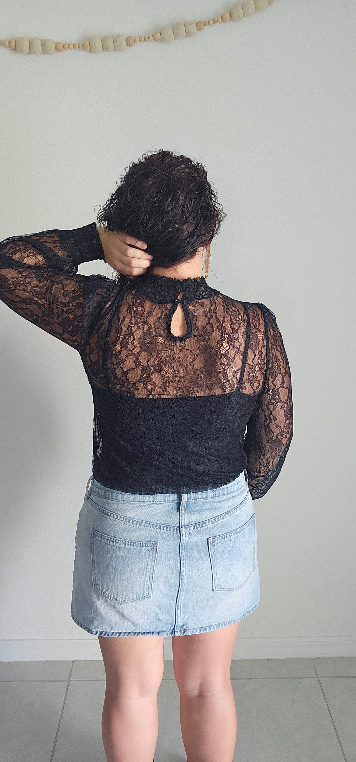 Look luxe and fabulous in the "Lainey Black Mesh Lace Long Sleeve Top" - complete with a elastic mock neck, elastic cuffs, and a beautiful floral pattern! And if you're feeling extra daring, you can even pair it with a bodysuit for a sassy look sure to turn heads! Sizes small through large.