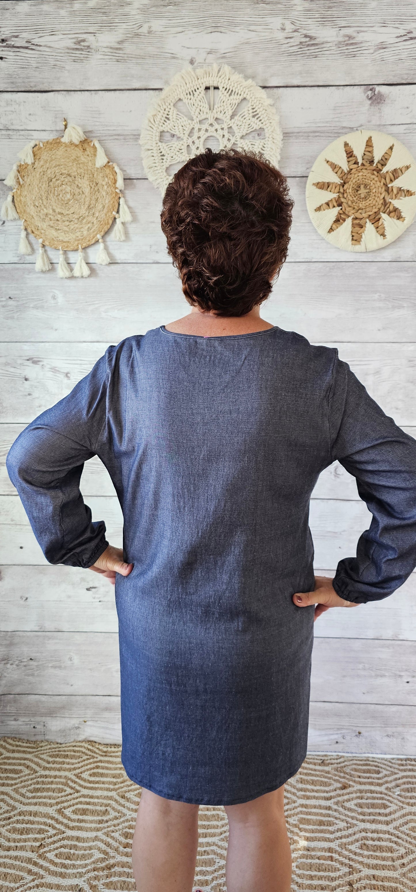 Imagine yourself in this dress going to the rodeo, line dancing, a party, or just hanging out with family and friends. This denim look dress offers a V-neck, and long sleeves that are cinched at the wrist. This dress is very comfy as it has a lot of give and is roomy. Sizes small through x-large.