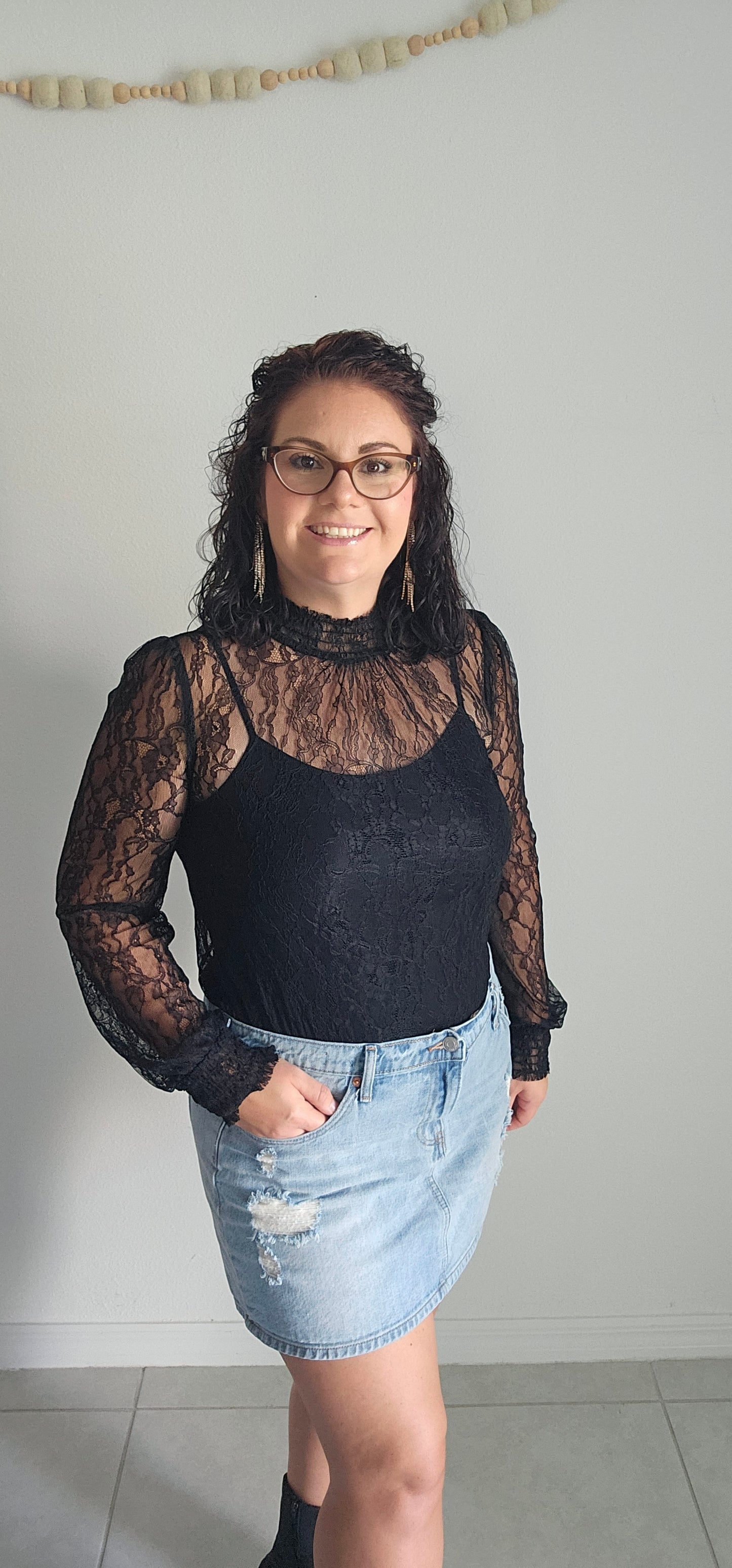 Look luxe and fabulous in the "Lainey Black Mesh Lace Long Sleeve Top" - complete with a elastic mock neck, elastic cuffs, and a beautiful floral pattern! And if you're feeling extra daring, you can even pair it with a bodysuit for a sassy look sure to turn heads! Sizes small through large.