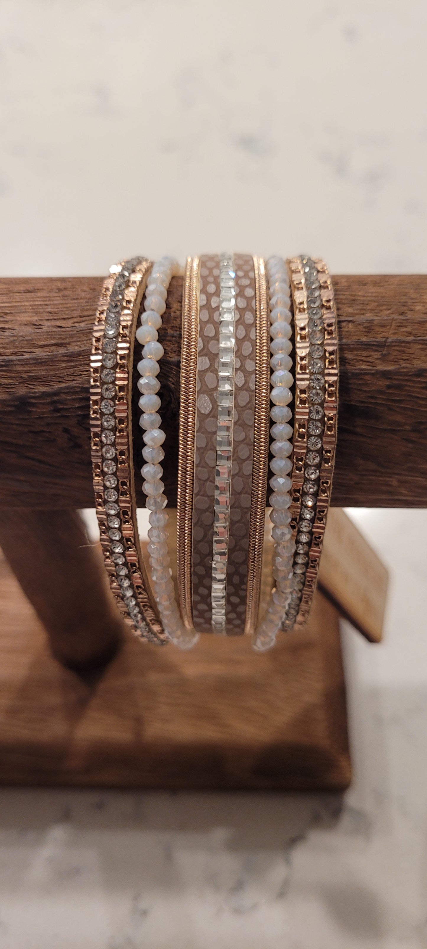 Pink Panache bracelet Color: 5-strand rose gold leather, white AB bead and rhinestone magnetic cuff bracelet Limited supply!