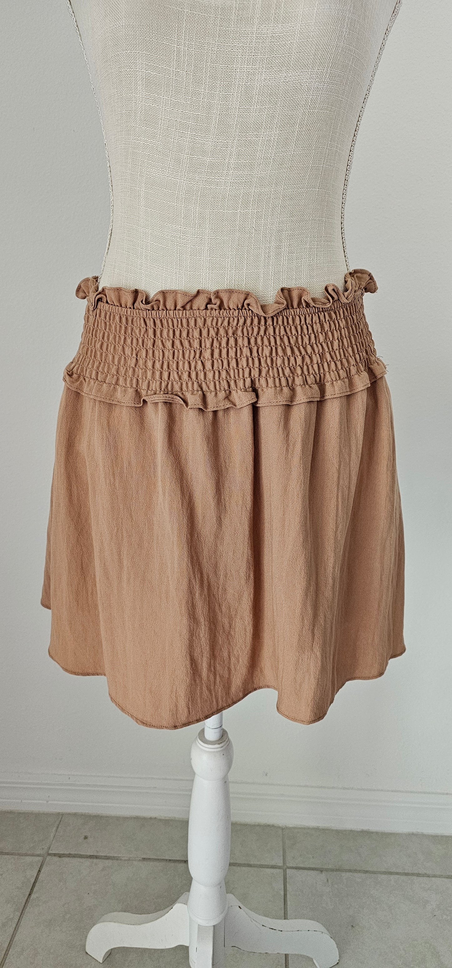 Let’s go exploring! “Lost In The Desert Skirt” features a cinched elastic waistband with ruffled trim, smocked skirt, and lined with shorts. This skirt pairs perfectly with “Lost In The Desert Top”. It is lightweight and breathable. Imagine exploring the mountains out west or dipping your toes in the Gulf of Mexico! This duo makes a perfect vacation outfit! Sizes small through large.