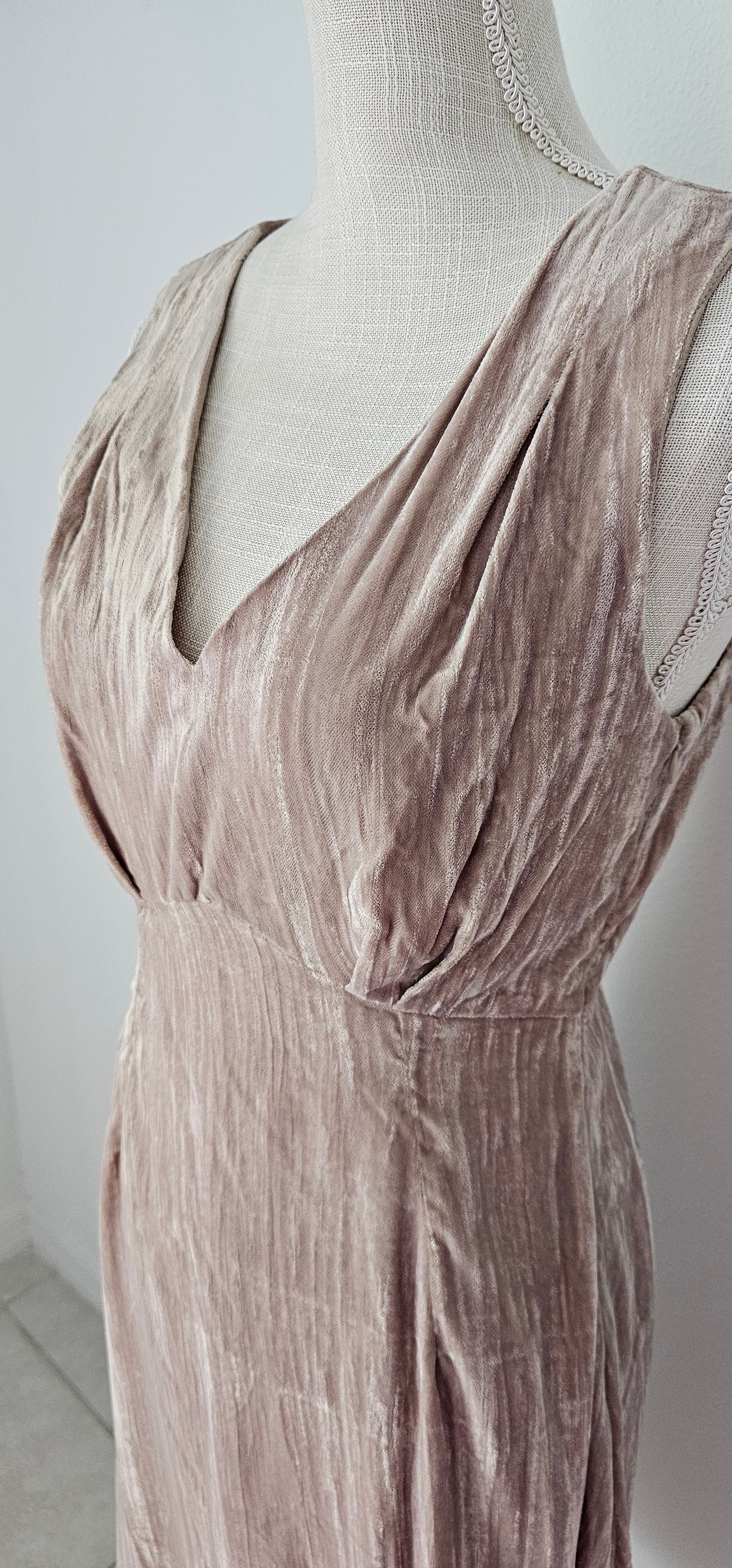 Look glam and chic in this "Amiri Almond Crinkle Velvet Sleeveless Dress"! With a luxurious v-neckline and back, zip it up with ease and get ready to turn heads. Slip it on and you'll be looking smokin' hot - velvet never looked so good! Sizes small through large.