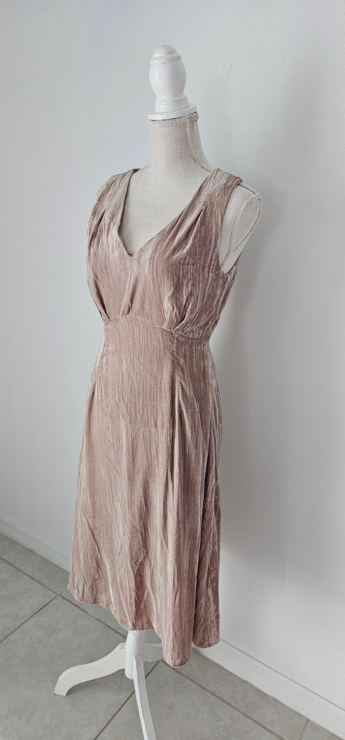 Look glam and chic in this "Amiri Almond Crinkle Velvet Sleeveless Dress"! With a luxurious v-neckline and back, zip it up with ease and get ready to turn heads. Slip it on and you'll be looking smokin' hot - velvet never looked so good! Sizes small through large.
