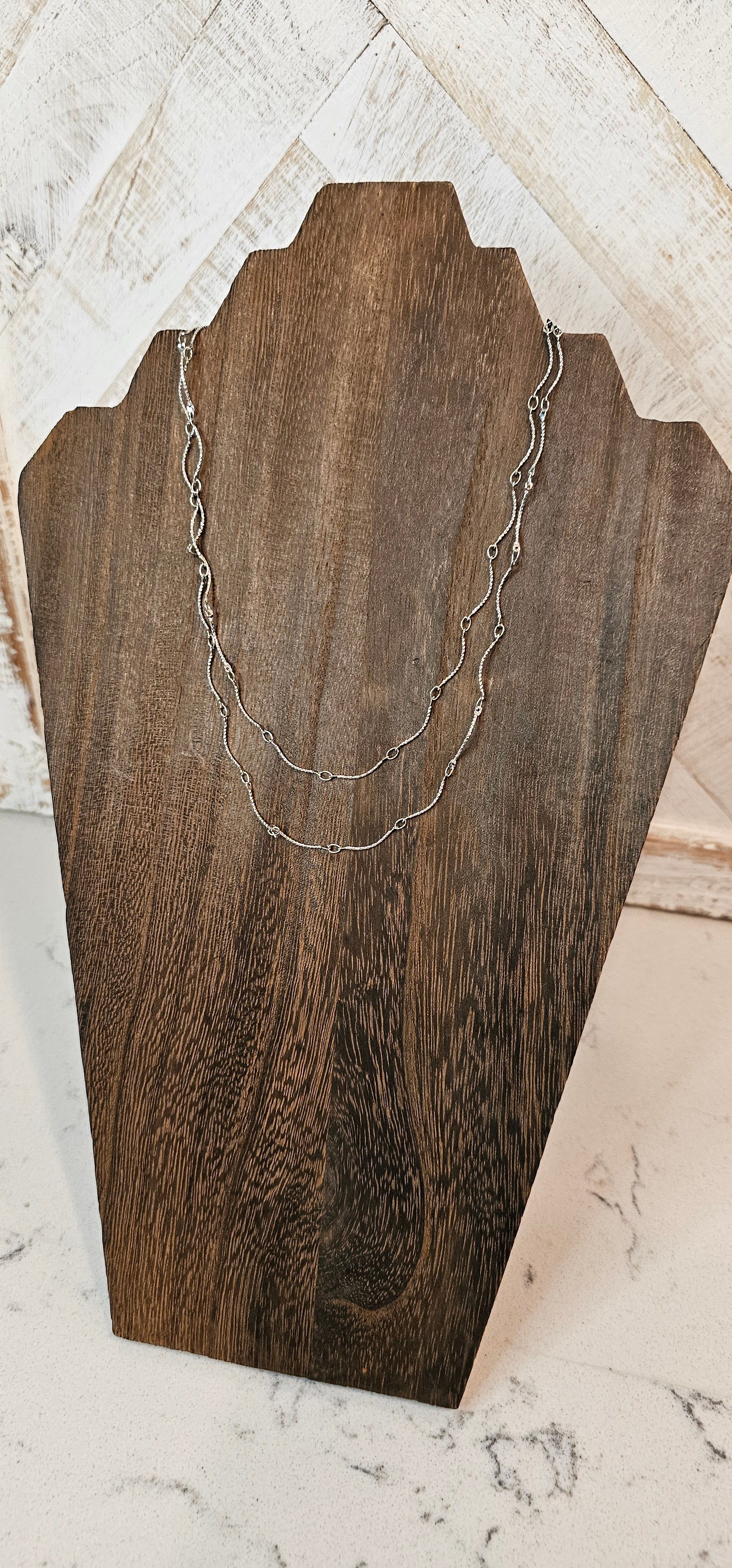 Approximate Length: Adjustable chain 16+2 inches Color: Silver wavy link chain Limited supply!