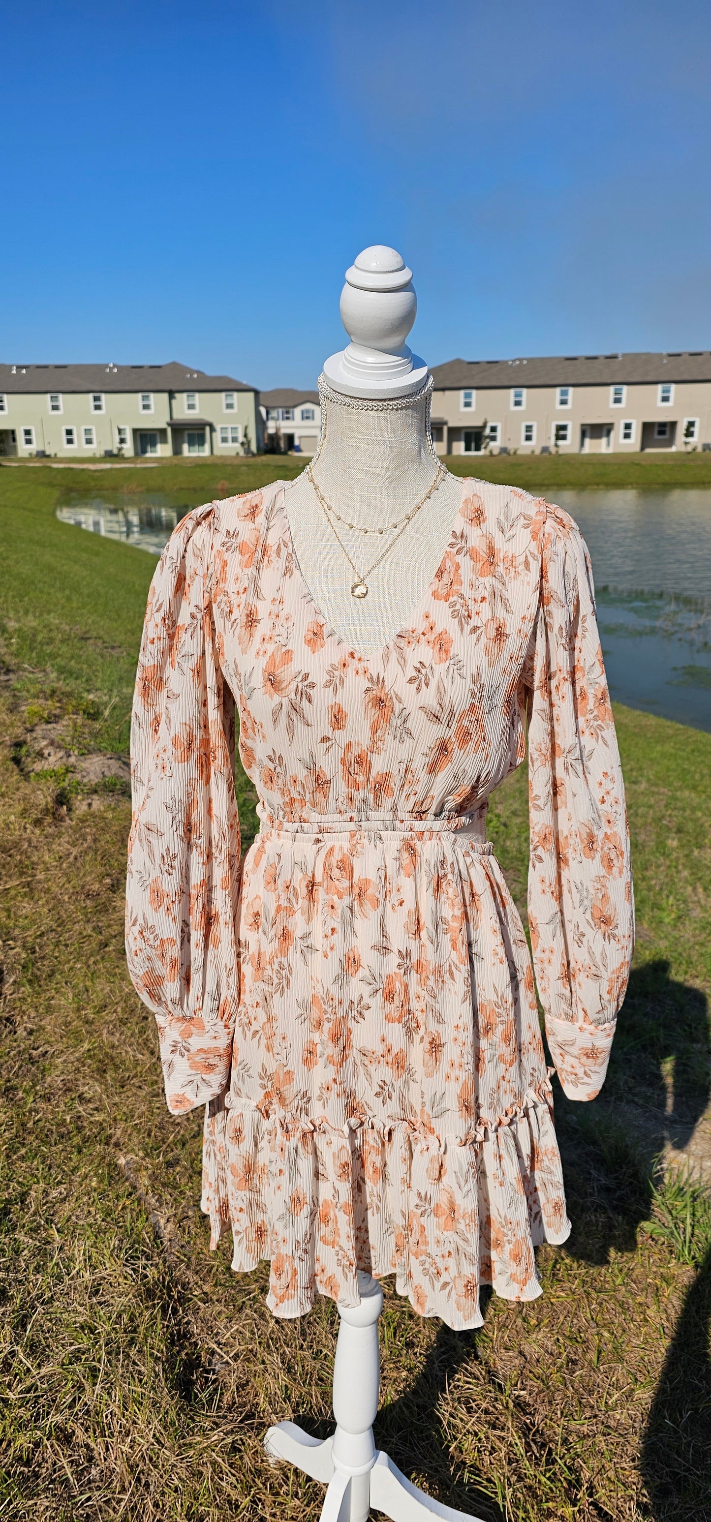 Turn heads in our "Sophie Floral Mini Dress"! This beautiful dress features a V-neckline, waist cut-out, bishop sleeves, and a ruffle hem that's sure to make you feel like a total cutie! And with its cute floral design, you'll have everyone blooming with envy. Get ready to be the center of attention! Sizes small through large.