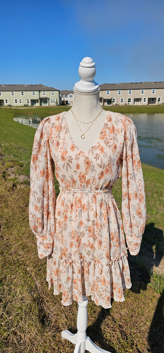 Turn heads in our "Sophie Floral Mini Dress"! This beautiful dress features a V-neckline, waist cut-out, bishop sleeves, and a ruffle hem that's sure to make you feel like a total cutie! And with its cute floral design, you'll have everyone blooming with envy. Get ready to be the center of attention! Sizes small through large.