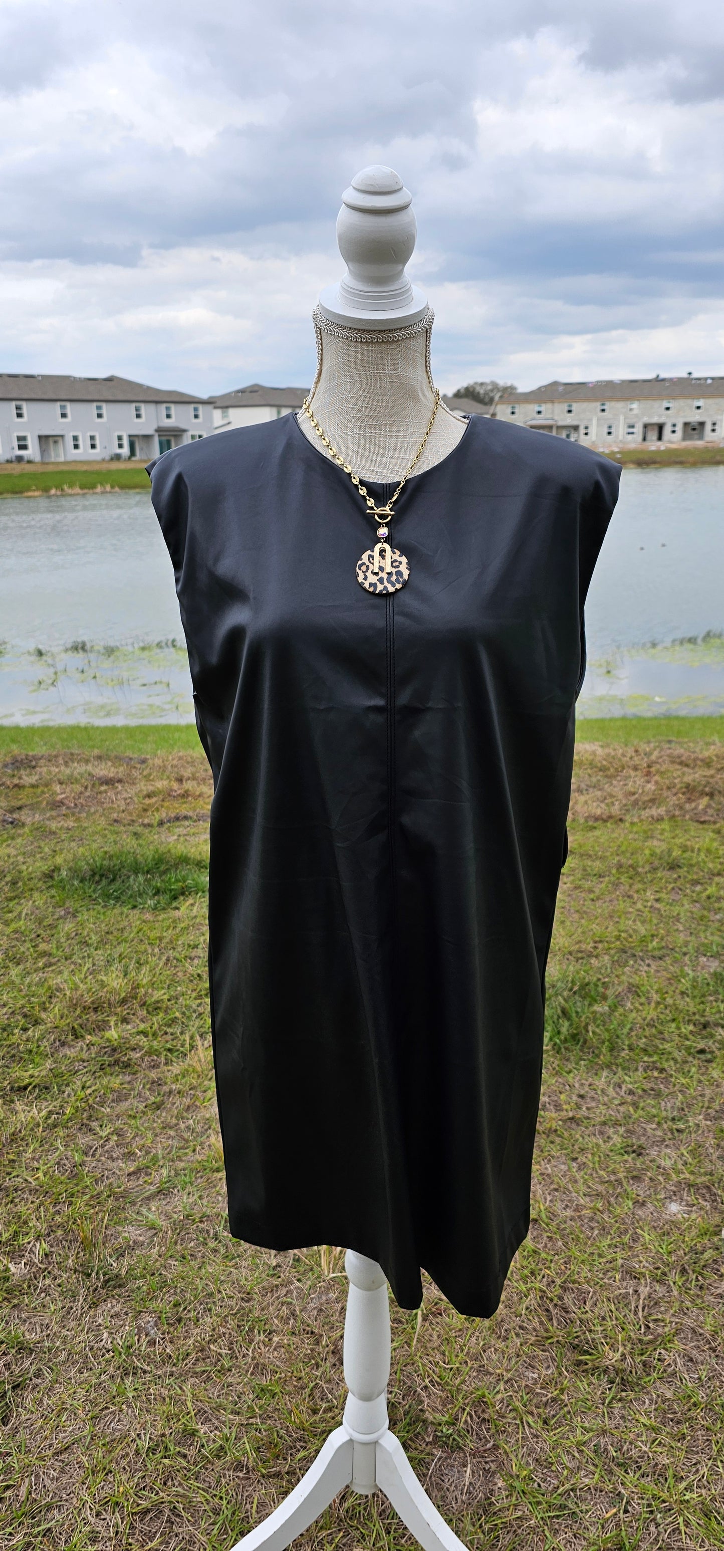This vegan leather sleeveless dress offers shoulder pads, belt loops (belt not included), back opening with button closure, and is matte vegan leather. Go ahead and strut your stuff! It is great for a date, going to the office, or hanging out with the girls. Change the look of your dress by wearing different style belts. Sizes small through x-large.