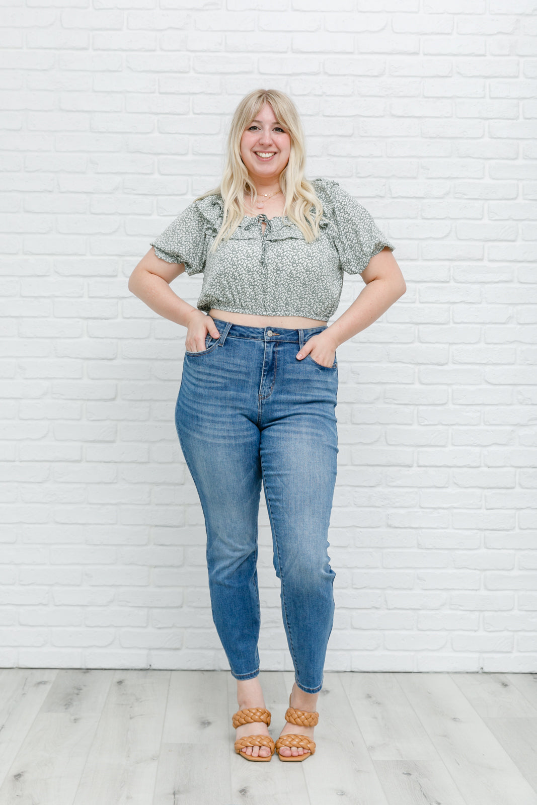 Head to date night in style in the Golden Hour Top! This cute top has all the details that we absolutely love. Featuring a ruffled elasticated neckline, keyhole detail on the front, balloon sleeves with elastic cuffs, and elastic waist. Not to mention it's in the most adorable tiny floral print! Pair with denim, nude sandals, and matching bag for an on trend look! S - 3X