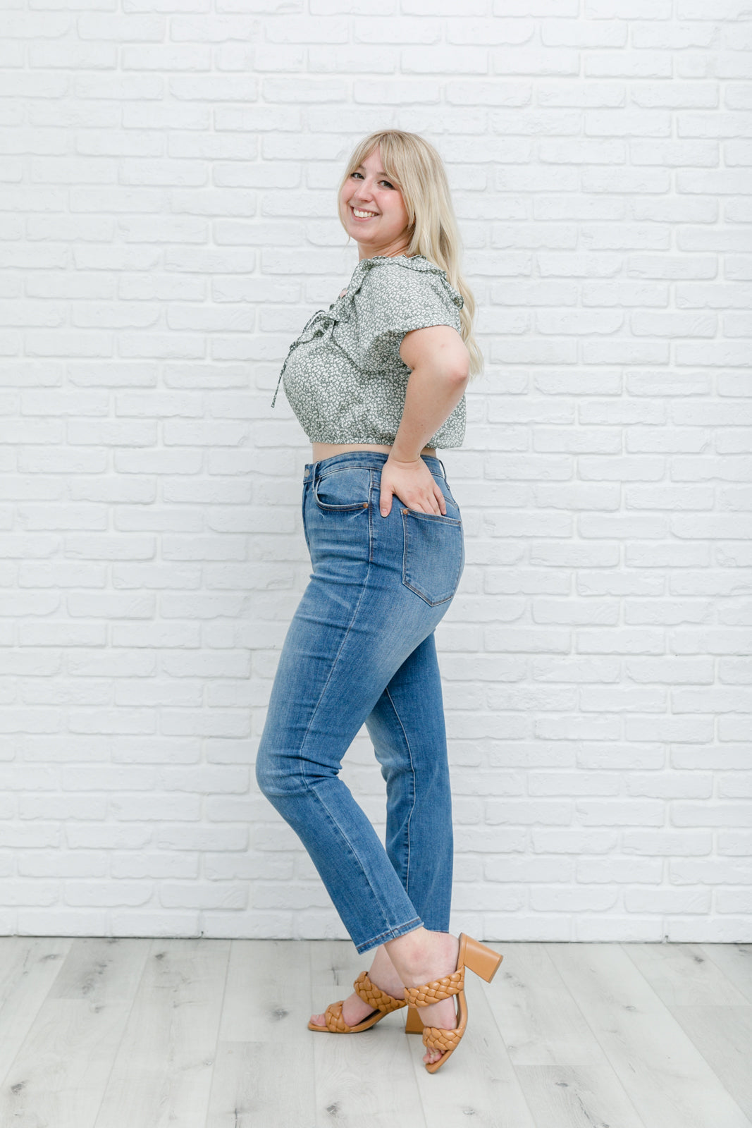 Head to date night in style in the Golden Hour Top! This cute top has all the details that we absolutely love. Featuring a ruffled elasticated neckline, keyhole detail on the front, balloon sleeves with elastic cuffs, and elastic waist. Not to mention it's in the most adorable tiny floral print! Pair with denim, nude sandals, and matching bag for an on trend look! S - 3X