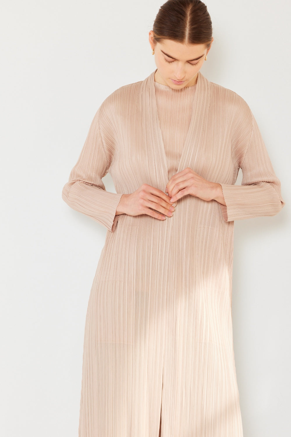 The Pleated Long Sleeve Cardigan is a versatile and chic layering piece for your wardrobe. With its pleated detailing and long sleeves, this cardigan offers a stylish and sophisticated look. The pleats add texture and visual interest to the classic cardigan design.