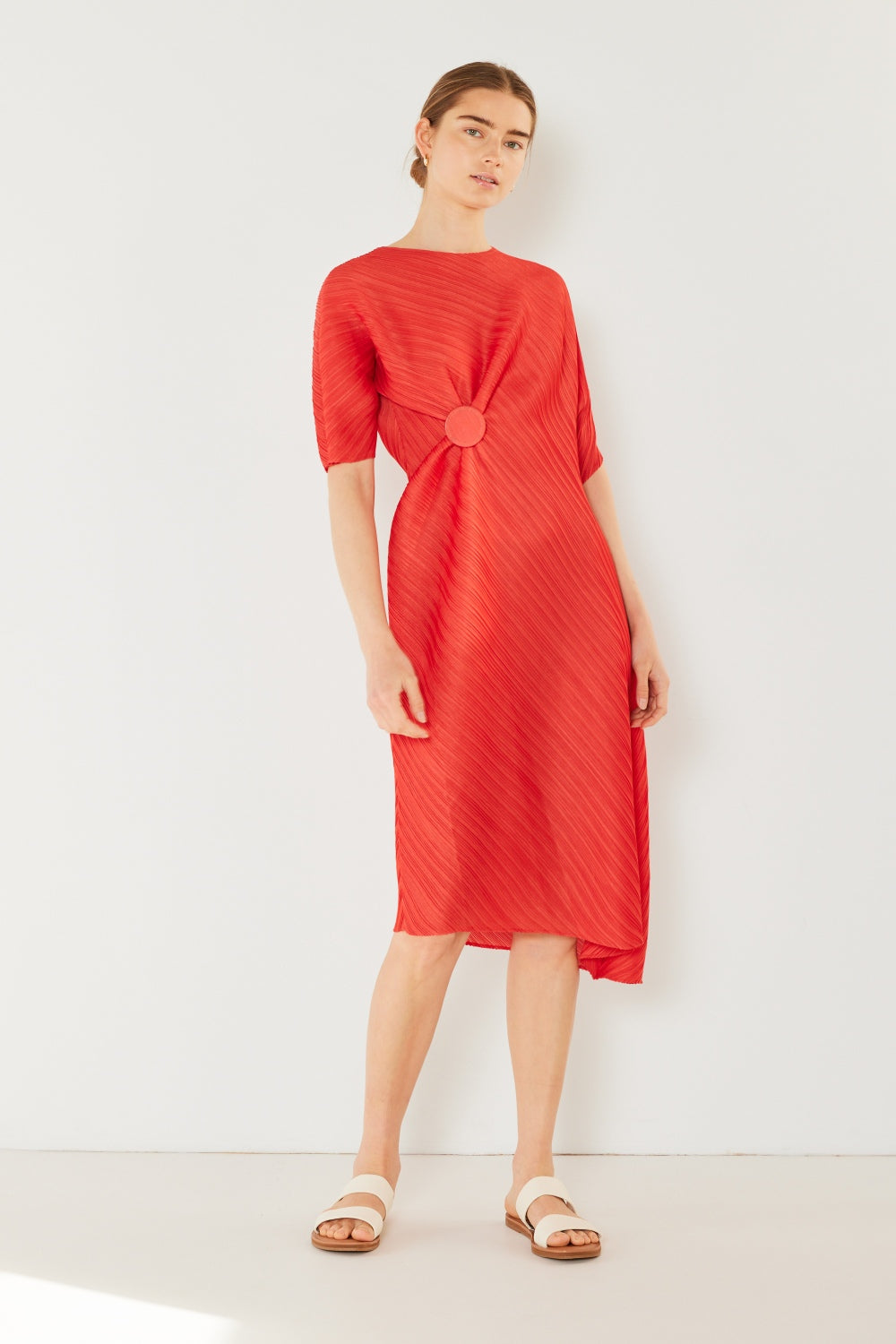 The Pleated Dolman Sleeve Dress is a modern and chic addition to your wardrobe. With its unique dolman sleeves and pleated detailing, this dress offers a stylish and sophisticated look. The relaxed silhouette and pleats create a flattering and comfortable fit.