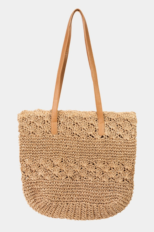 Straw Braided Tote Bag with Tassel is a charming and fashionable accessory that combines the natural texture of straw with a playful tassel detail. The braided design adds a touch of bohemian flair, perfect for summer days or beach outings.