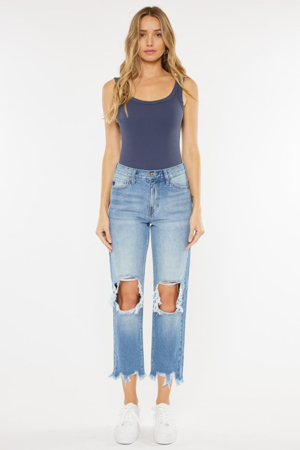 High Waist Chewed Up Straight Mom Jeans are the ultimate combination of vintage-inspired style and trendy edge. These jeans, with their high waistline, provide a flattering and comfortable fit that accentuates your curves.