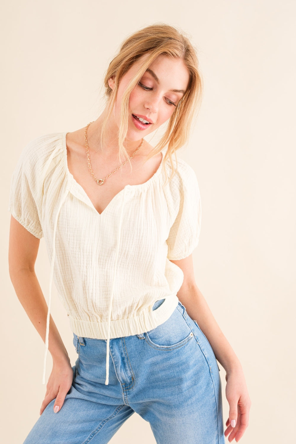 This Cotton Gauze Back Waist Tie Cropped Top is a stylish and versatile piece for your wardrobe. The back waist tie adds a unique touch to the design. Made with lightweight cotton gauze fabric, it is comfortable to wear in any season. S - XL