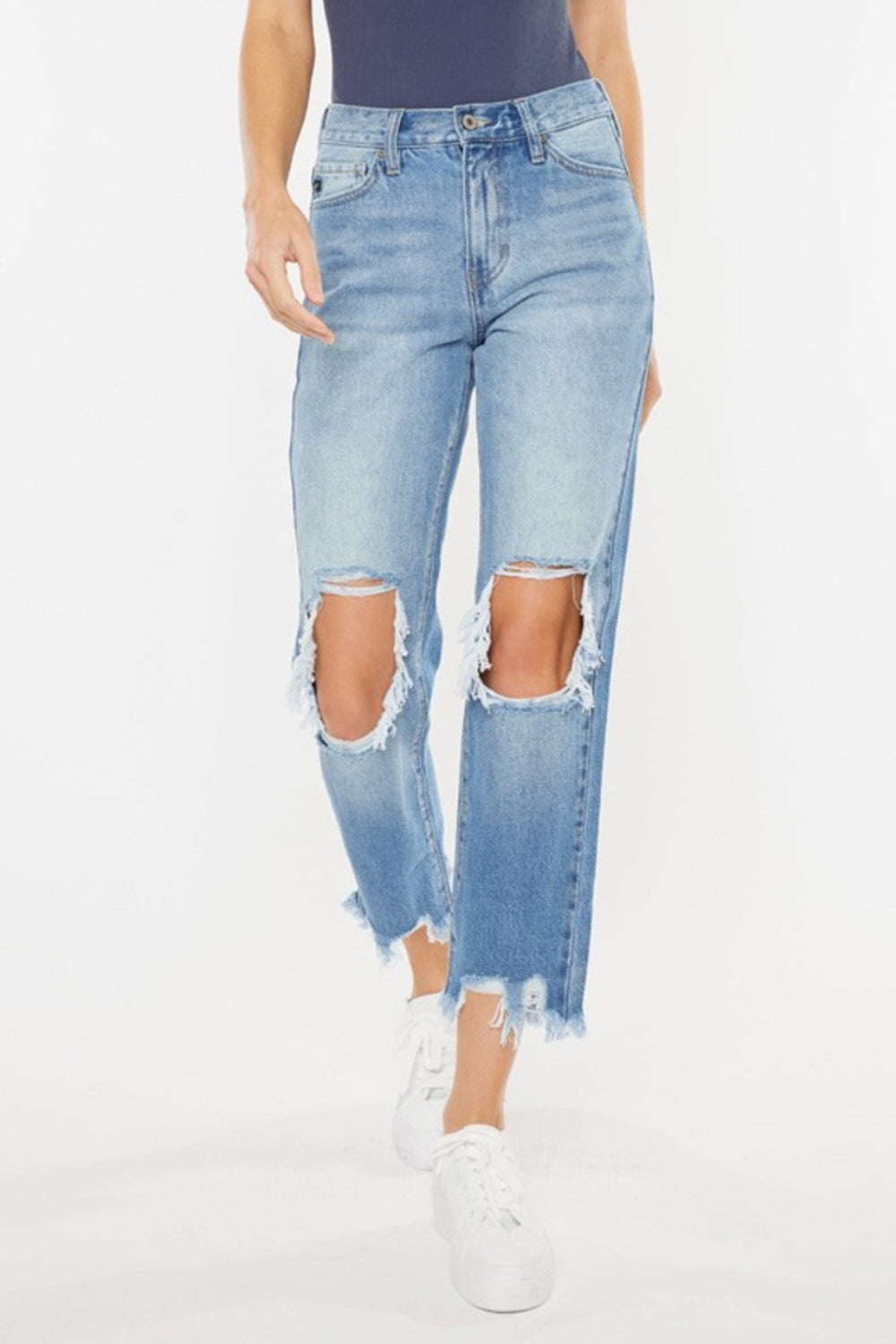 High Waist Chewed Up Straight Mom Jeans are the ultimate combination of vintage-inspired style and trendy edge. These jeans, with their high waistline, provide a flattering and comfortable fit that accentuates your curves.