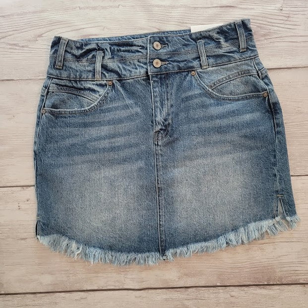 Imagine yourself in this cute denim high rise skirt. This skirt features a frayed hem. A jean skirt is a staple to anyone's life. This cute skirt you can dress up or down. Imagine yourself wearing this to the office, school, out on the town, or just because. This cute skirt can be worn with pretty much any top, sweater, or sweatshirt.