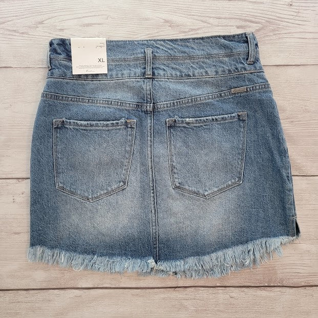 Imagine yourself in this cute denim high rise skirt. This skirt features a frayed hem. A jean skirt is a staple to anyone's life. This cute skirt you can dress up or down. Imagine yourself wearing this to the office, school, out on the town, or just because. This cute skirt can be worn with pretty much any top, sweater, or sweatshirt.