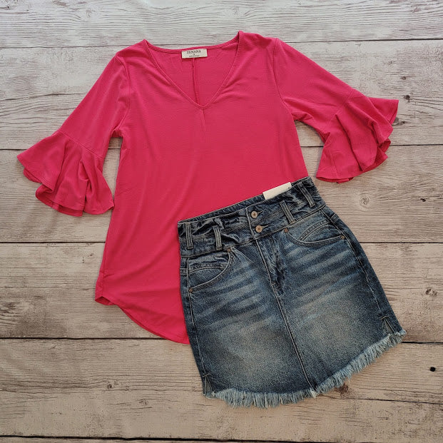 Imagine yourself in this cute denim high rise skirt. This skirt features a frayed hem. A jean skirt is a staple to anyone's life. This cute skirt you can dress up or down. Imagine yourself wearing this to the office, school, out on the town, or just because. This cute skirt can be worn with pretty much any top, sweater, or sweatshirt.