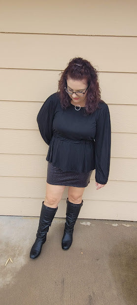 Imagine yourself in this cute little black skirt. This is a fitted mini skirt that is super edgy and chic. You'll be sure to turn heads in this skirt. It features a glossy animal print that is black, and a stretchy waist band. Go ahead and strut your stuff girl!
