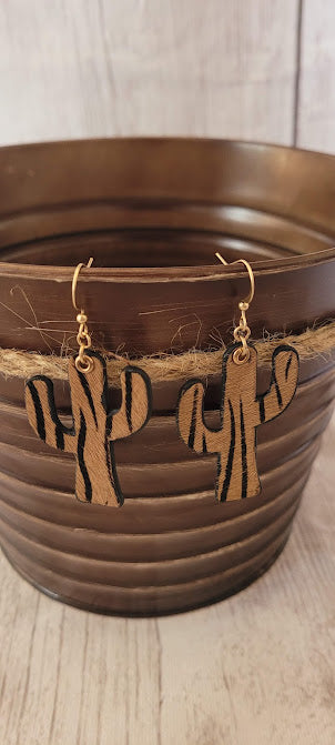 Zebra Cactus Earrings Cactus design Genuine leather Brown zebra print Gold fish hook Gold eyelet Rubber earring back Whether you want to be on the wild side or classy this earring set it will add a fun touch to your outfit