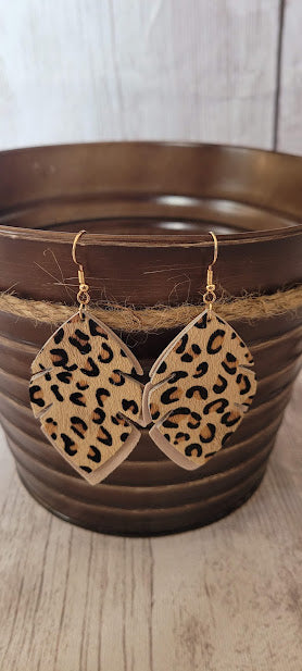 Tan Leopard Leaf Earrings Tan genuine leather Leopard print Two layer leaf Gold fish hook Rubber earring back Length 2.56”, width 1.57” Country or western look Whether you want to be on the wild side or classy this earring set it will add a fun touch to your outfit