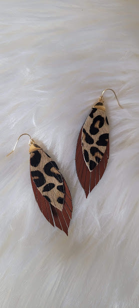 Sienna Leopard Fringe Earrings Sienna color genuine leather Fringe Leopard print Two layer marquise Brushed gold fish hook dangle earrings Rubber earring back Length 1.5”, width 0.5” Country or western look Whether you want to be on the wild side or classy this earring set it will add a fun touch to your outfit