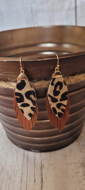 Sienna Leopard Fringe Earrings Sienna color genuine leather Fringe Leopard print Two layer marquise Brushed gold fish hook dangle earrings Rubber earring back Length 1.5”, width 0.5” Country or western look Whether you want to be on the wild side or classy this earring set it will add a fun touch to your outfit