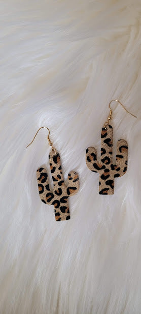 Light Brown Leopard Cactus Earrings Light brown genuine leather Leopard print Gold fish hook Country or western look Whether you want to be on the wild side or classy this earring set it will add a fun touch to your outfit